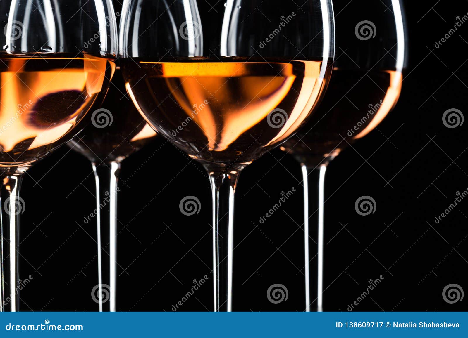 glasses of wine in darkness