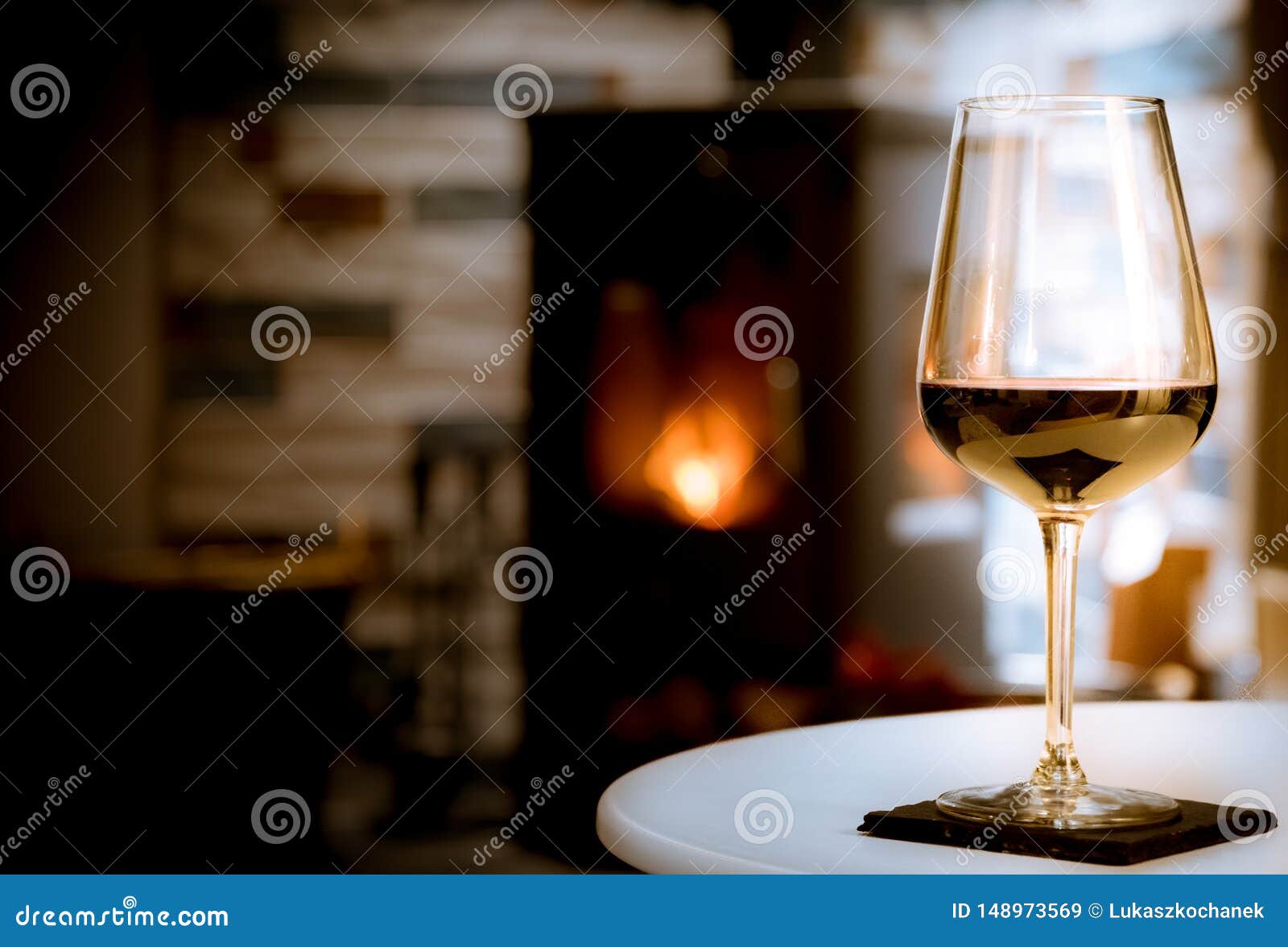 Glass Of Red Wine On Cozy Fireplace Background Stock Image Image of