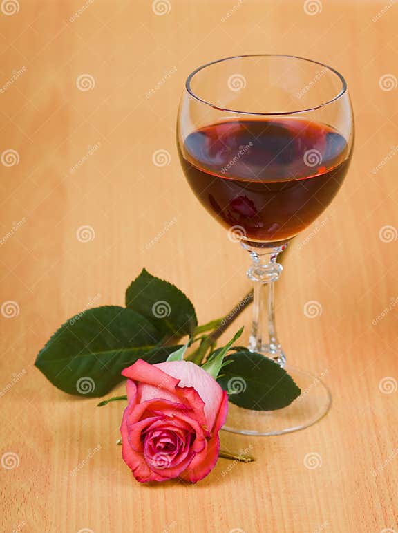 Glass of red wine and rose stock image. Image of yellow 14062173