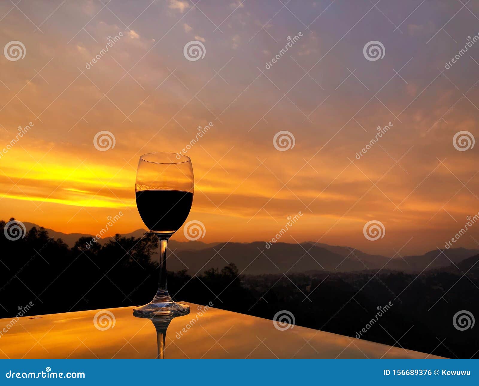 Glass of Red Wine during Sunset Over Himalayan Mountain Range in Nepal