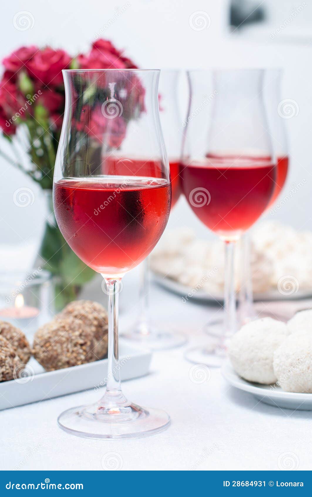 Glass of Rose Wine in the Foreground Stock Image Image of crystal