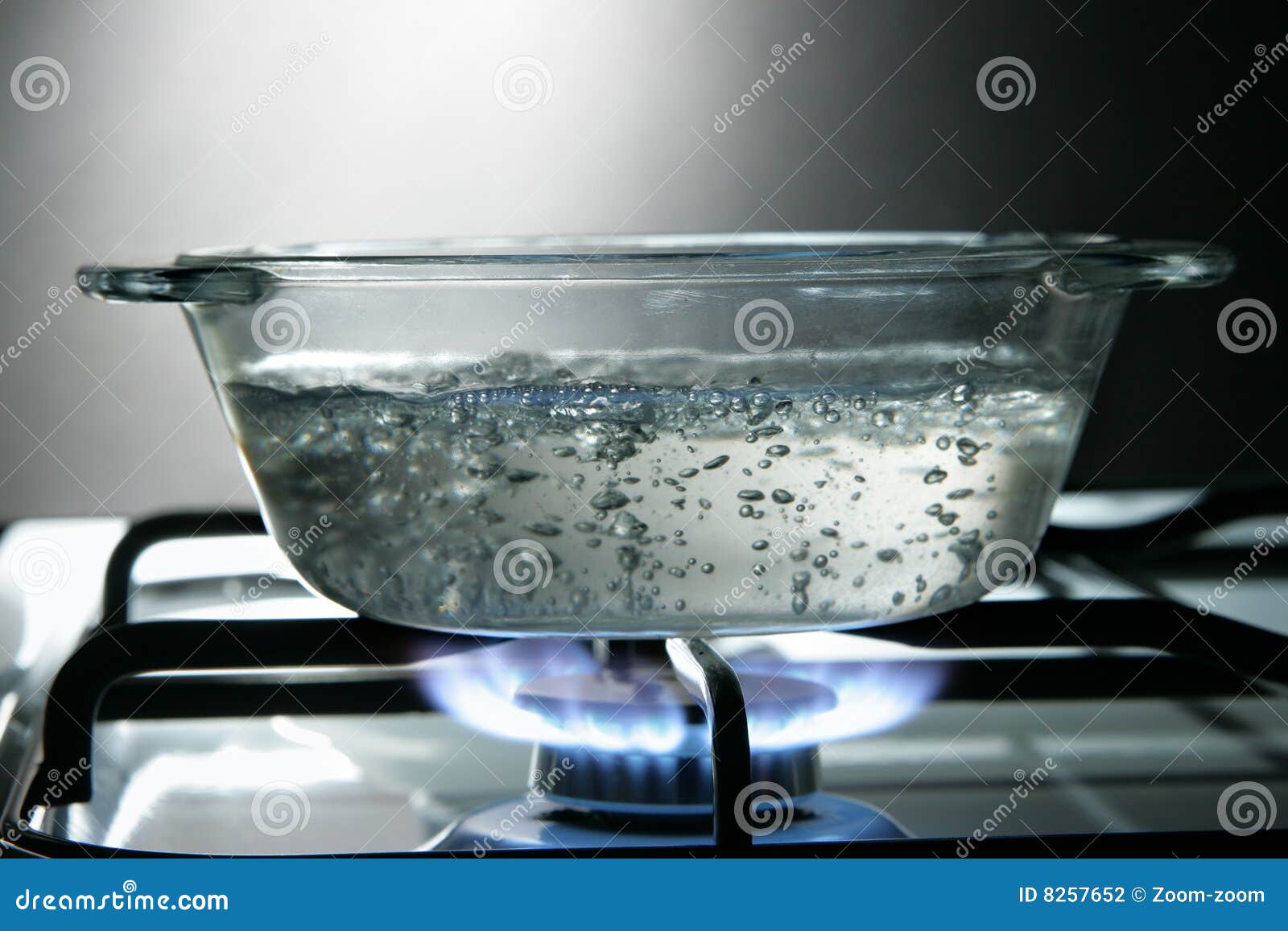 Glass saucepan on the gas stove close-up