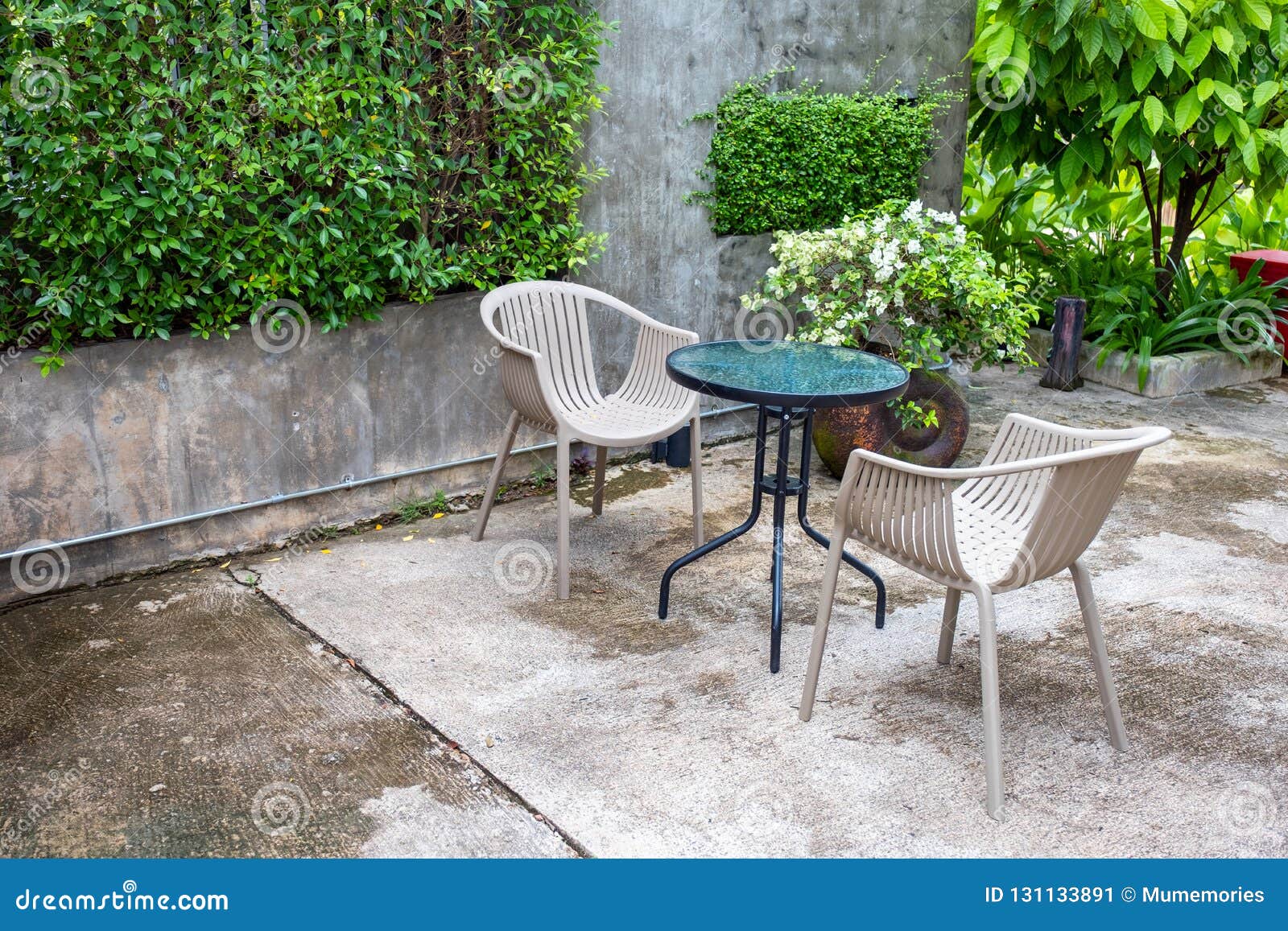 Glass Table with Chairs in Garden Stock Image Image of glass, ornate