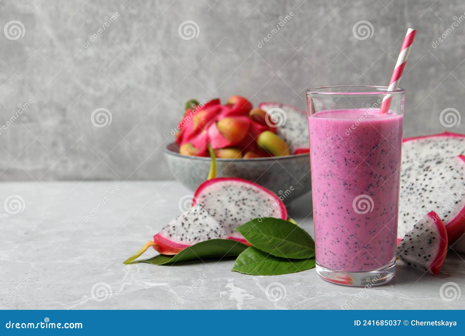 Glass of Tasty Pitahaya Smoothie and Fresh Fruits on Light Grey Table ...