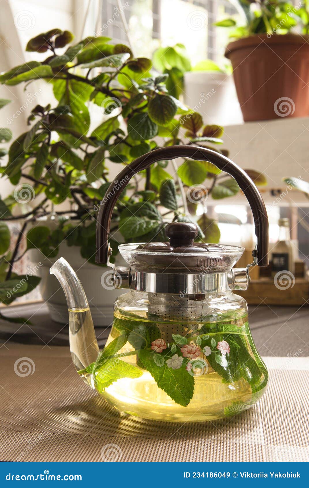 Glass teapot with mint tea stock image. Image of design 234186049