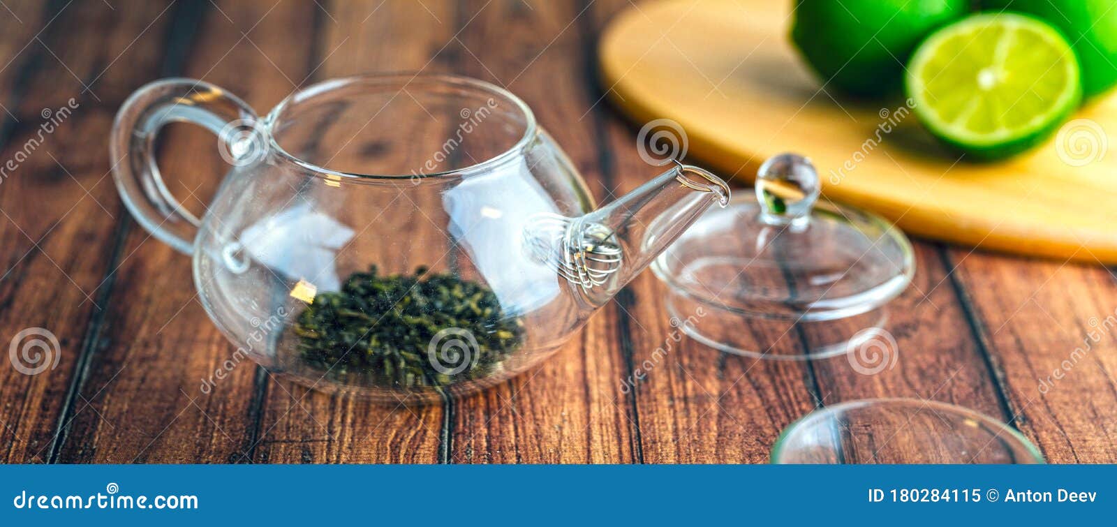 A Glass Teapot with Tea Leaves Inside on a Wooden Table. Stock Image Image of teatime