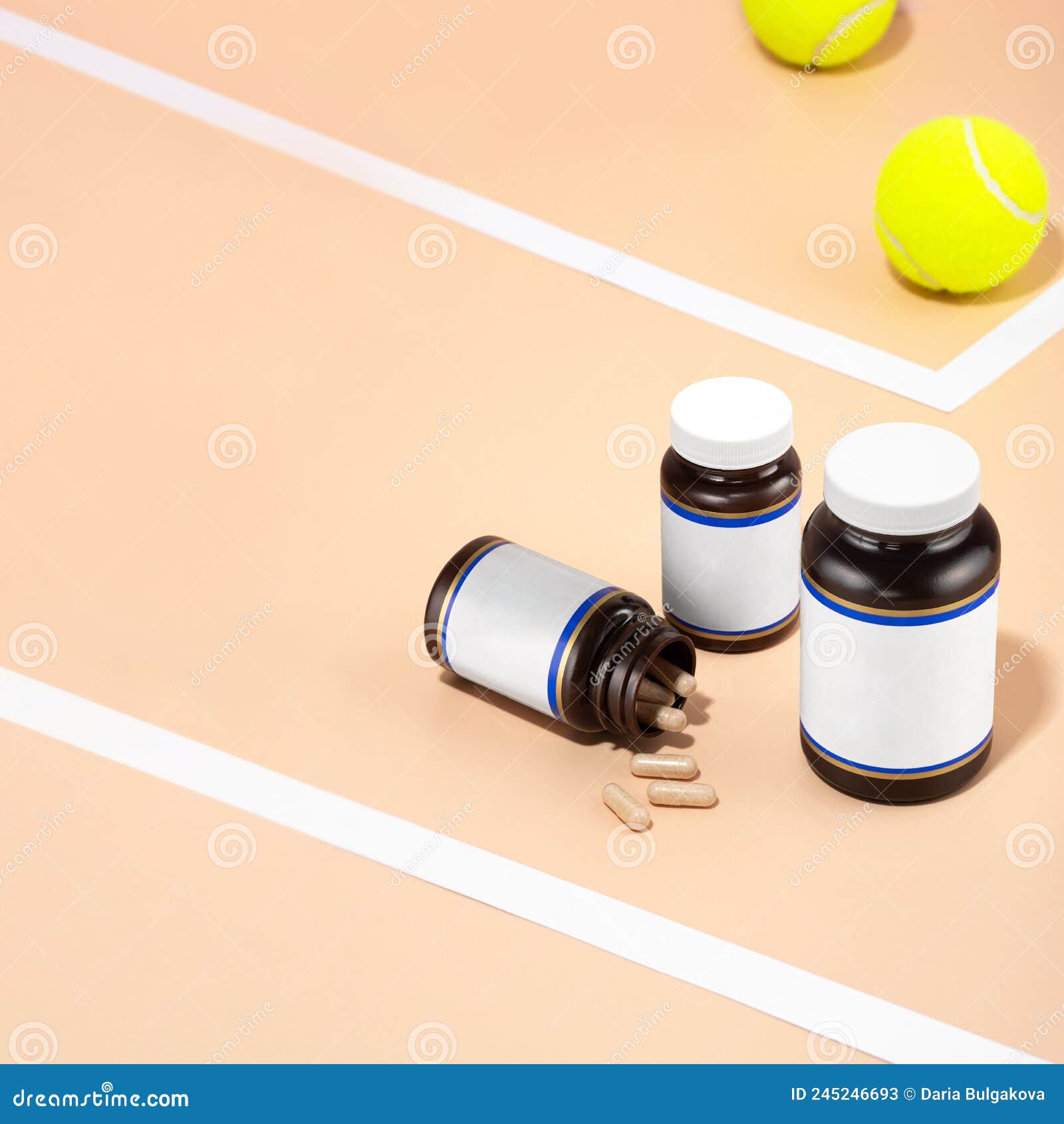 glass vials with natural-colored chondroprotector capsules lying on the tennis court. healing of joint injuries. dietary