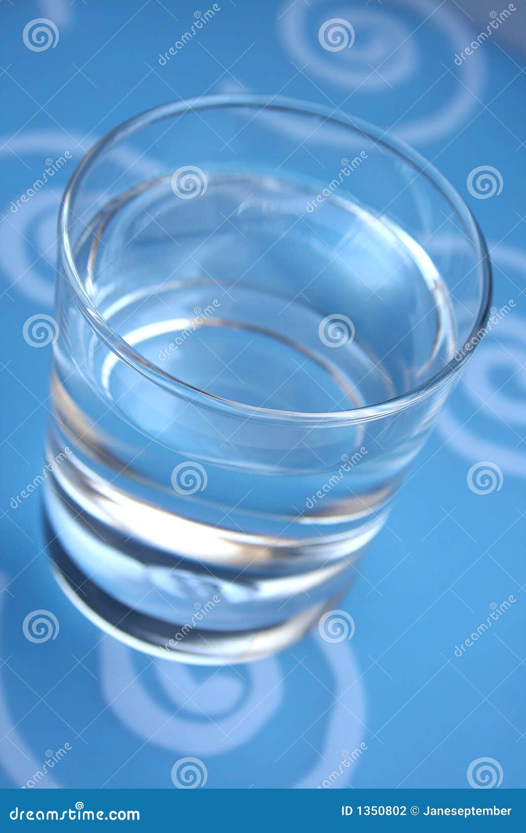 Four Beautiful Glass Cup Filled With Water In Blue Stock Photo, Picture and  Royalty Free Image. Image 8160433.