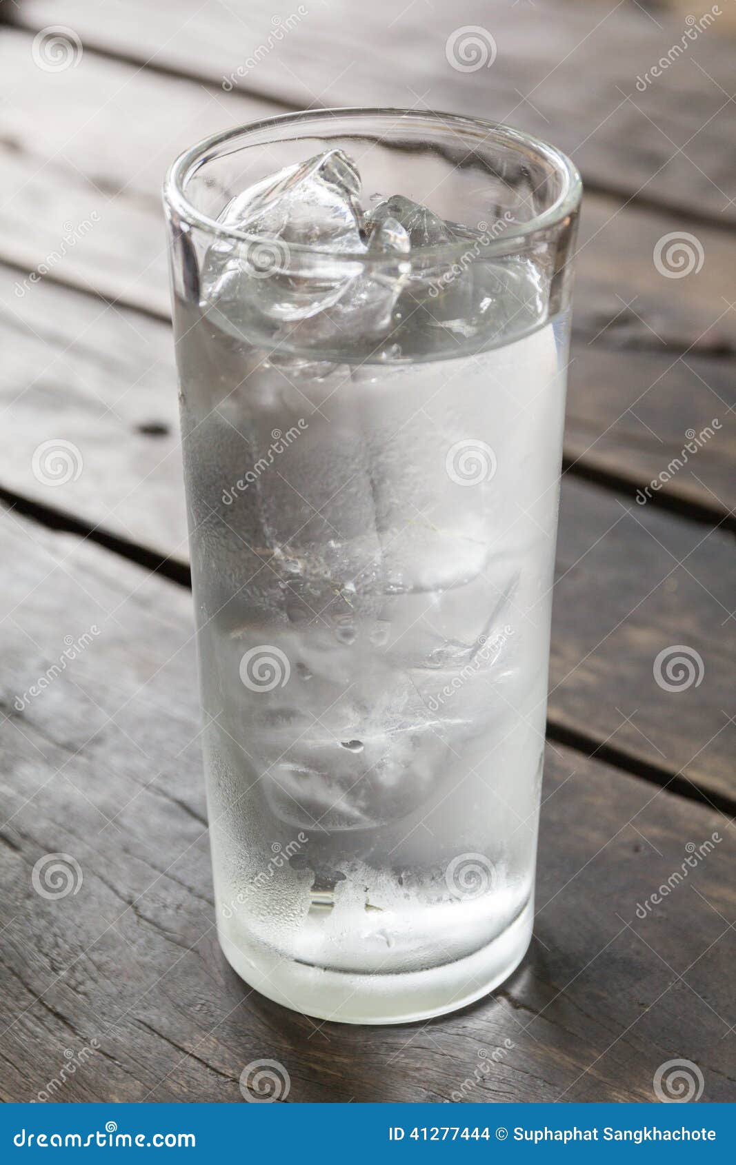Glass Of Water With Ice On The Wooden Table Stock Photo 