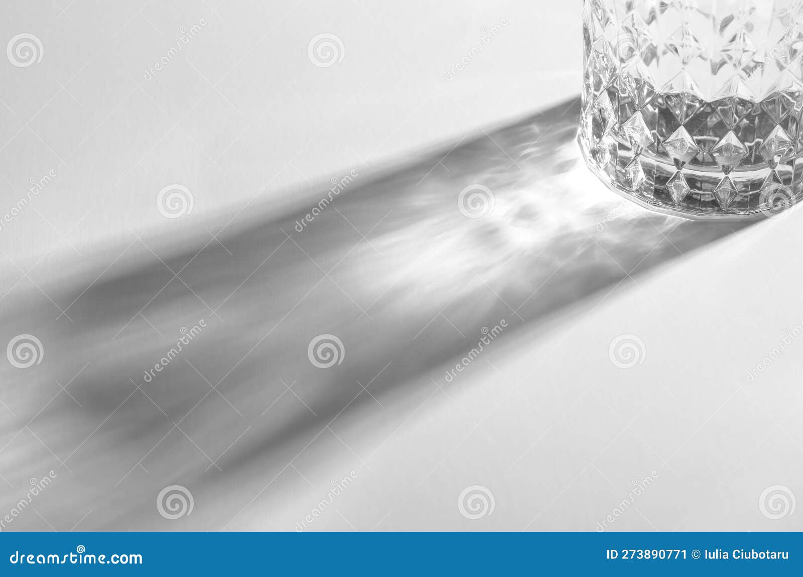 A Glass with Water and Sharp Shadows, Caustic Effect As Light Passes