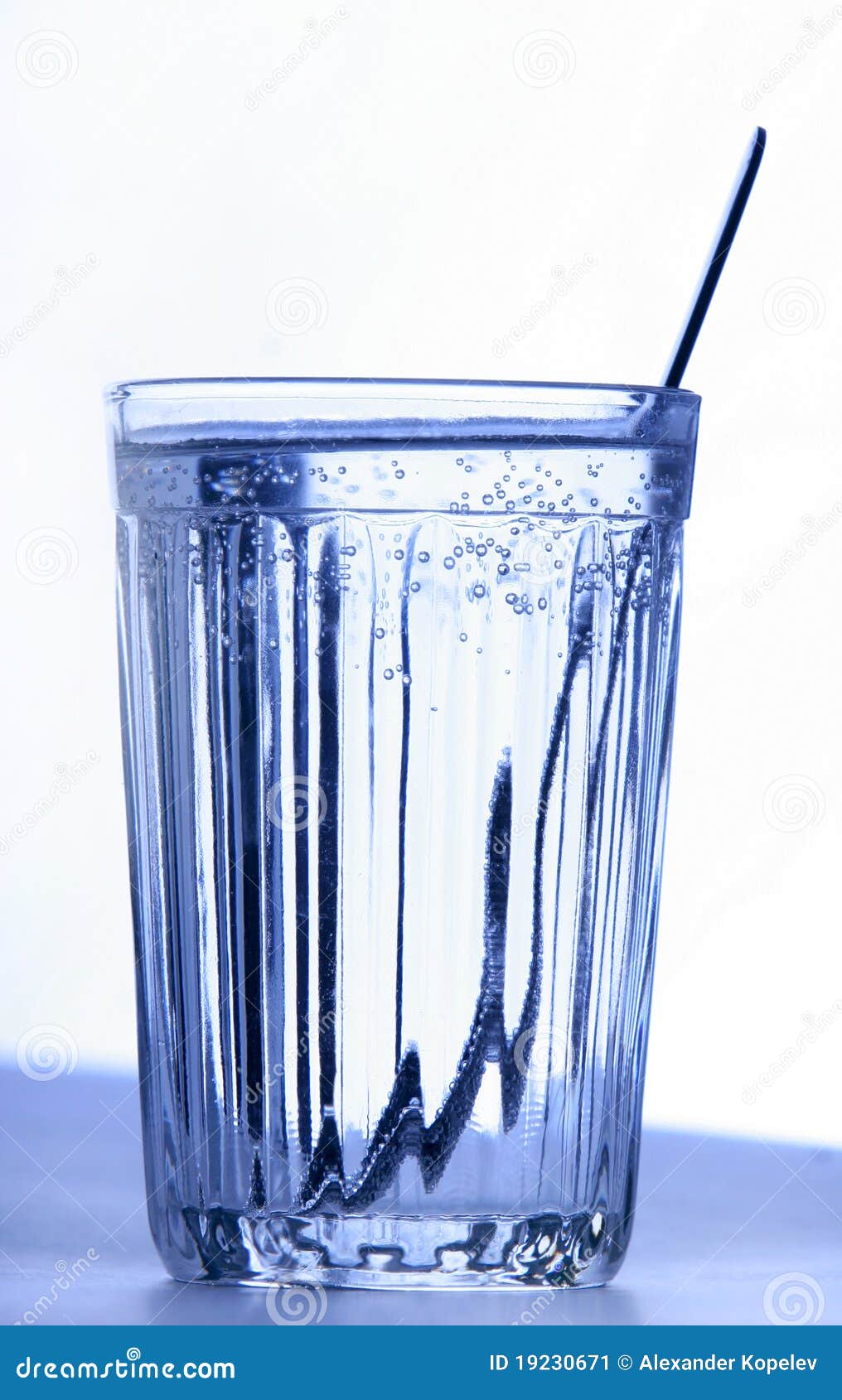 A Glass with Water and Teaspoon Stock Image Image of scoop, suspended