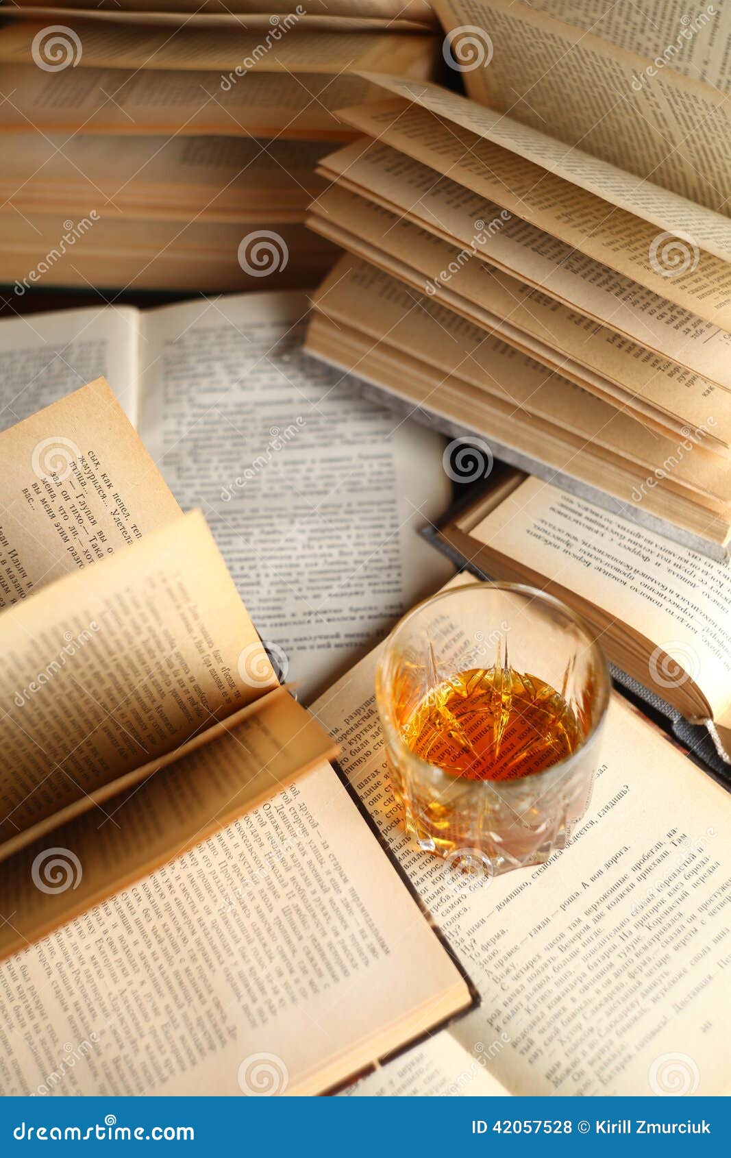 glass of whiskey on books