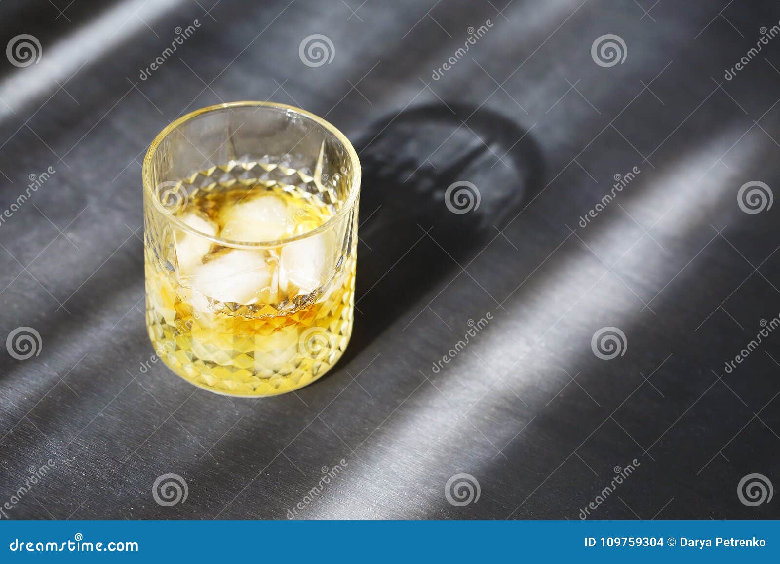 glass of whiskey on dark background. close up