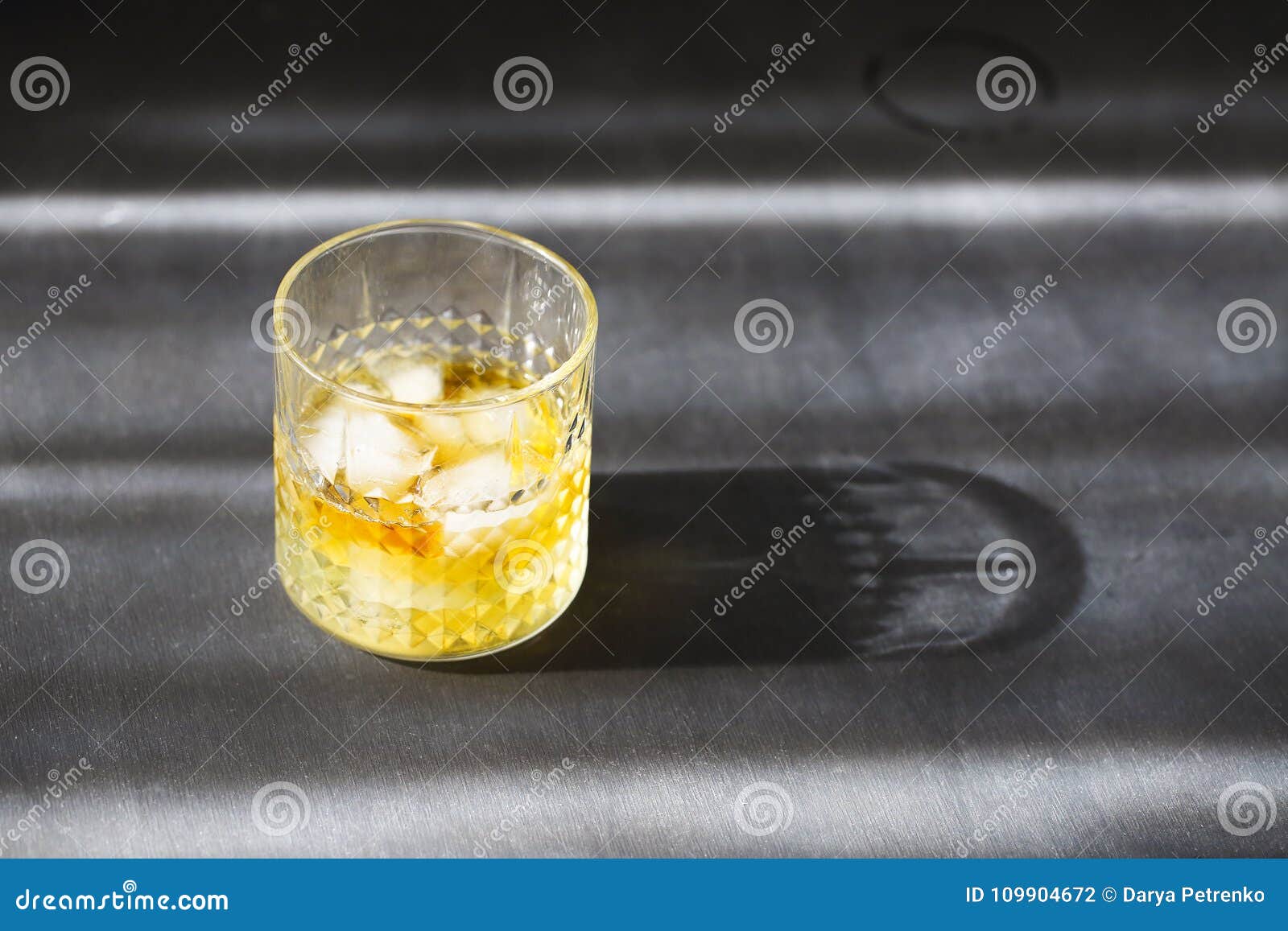 glass of whiskey on dark background. close up