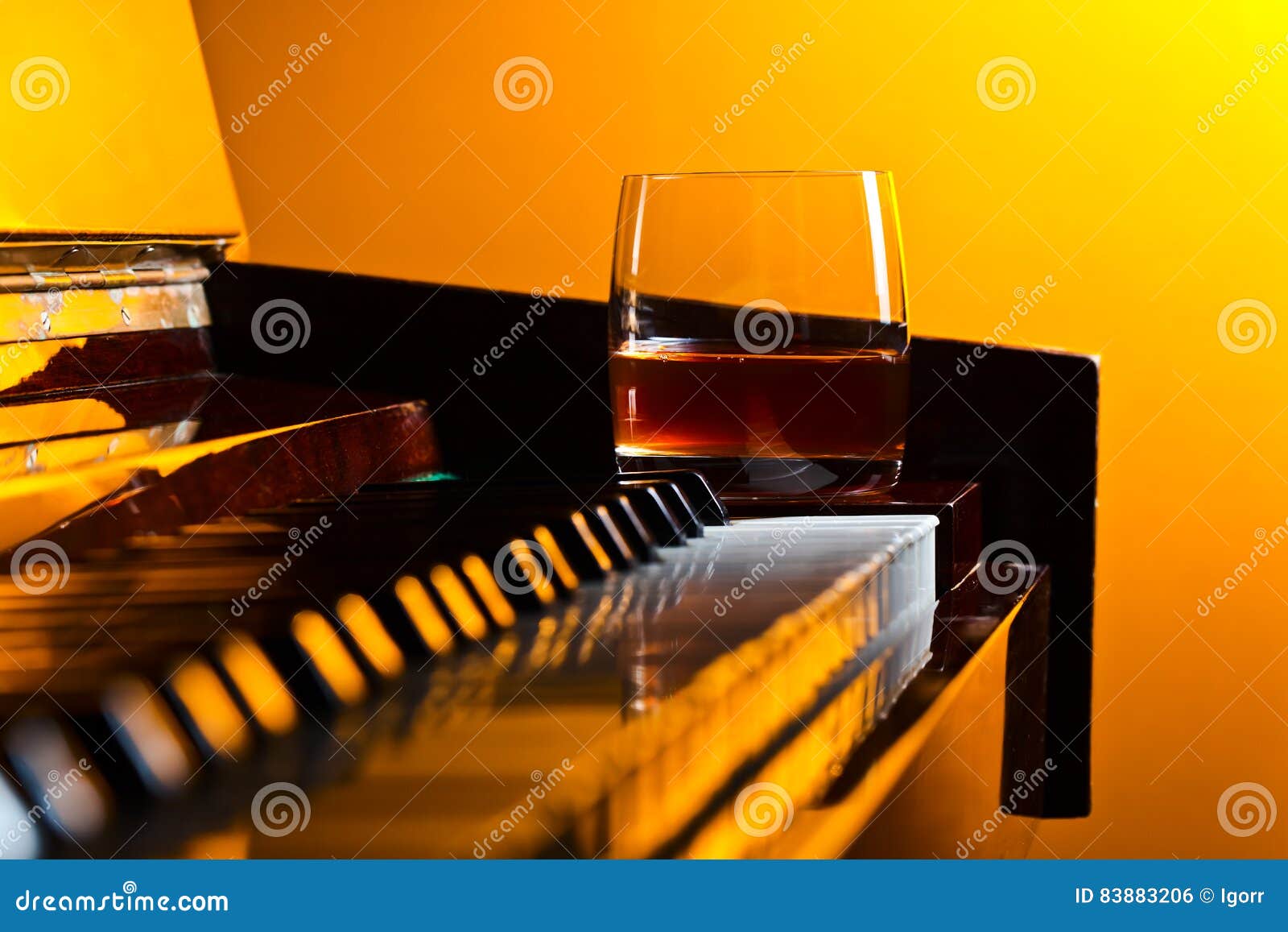 Glass with whiskey stock photo. Image of gold, light 83883206