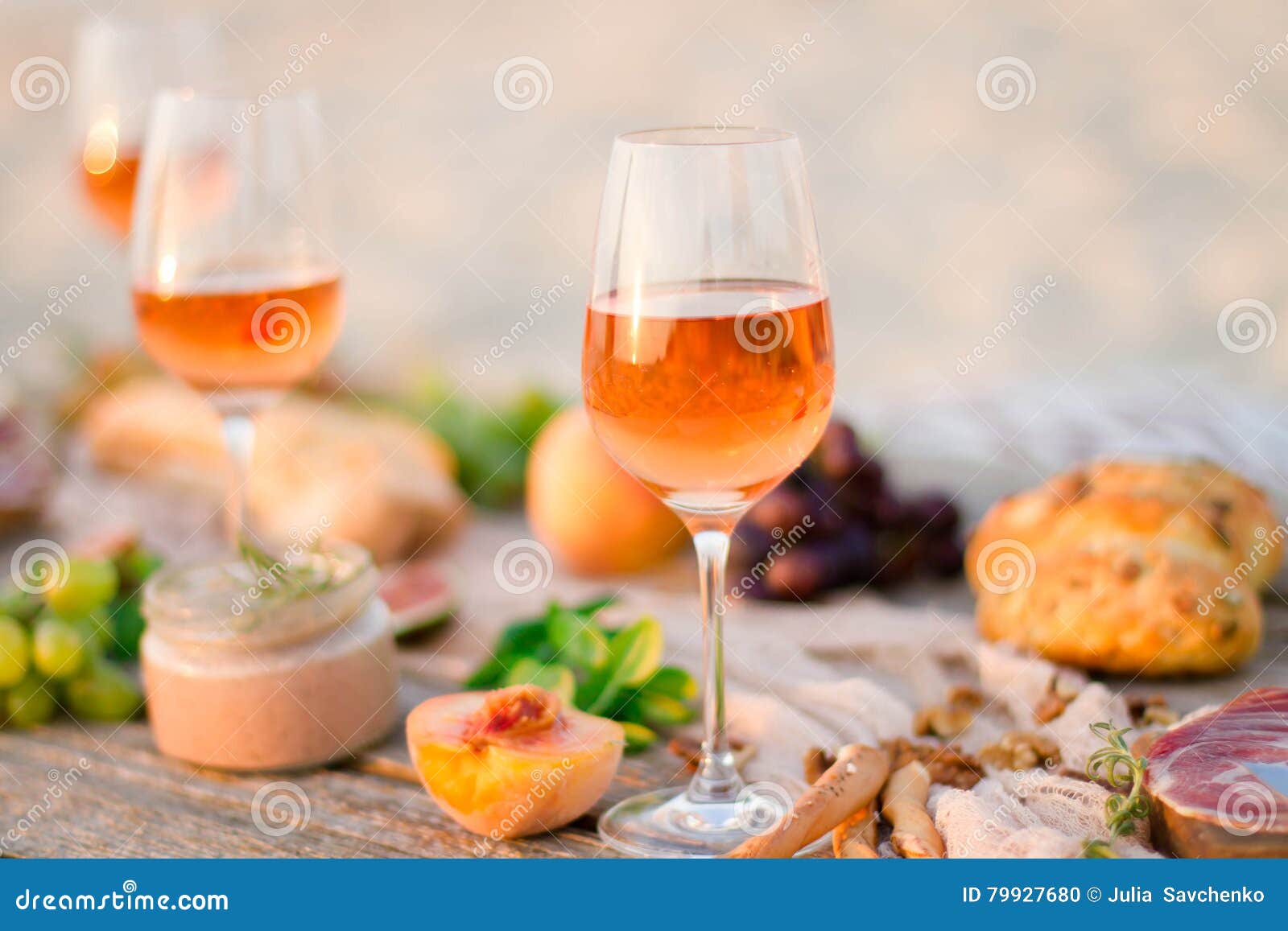 Glass of White Wine on Picnic Table. Stock Photo Image of people