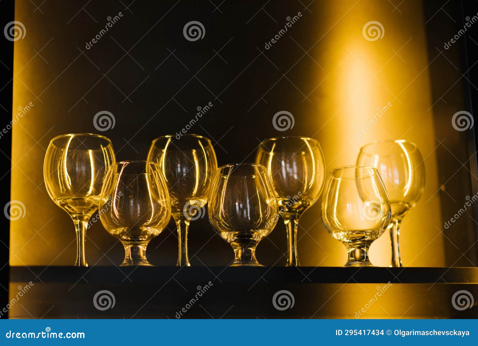 Glass Wine Glasses on the Shelf in the Wine Library Stock Photo Image