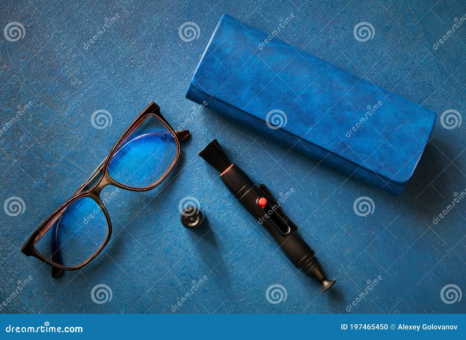 Glasses, Glasses Case and Cleaning Handle for Optics, on Blue