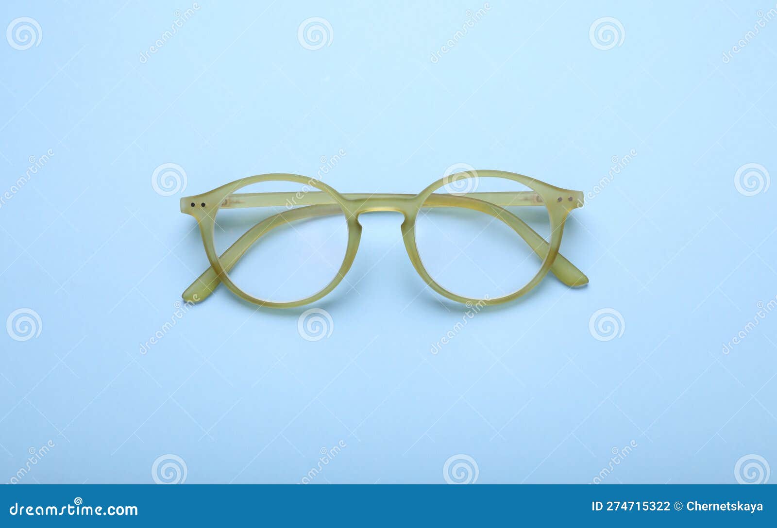 Glasses with Corrective Lenses on Light Blue Background, Top View Stock