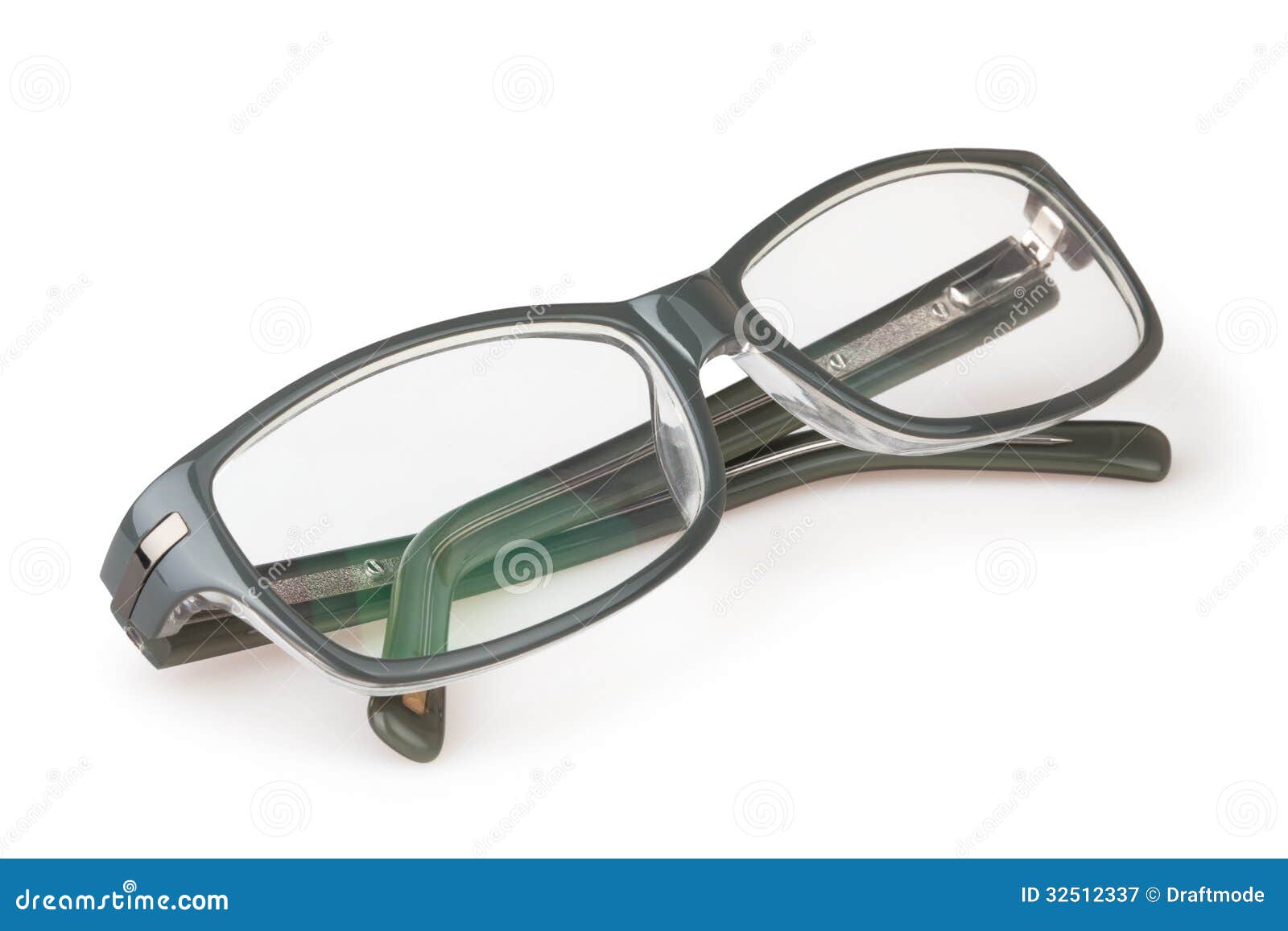 Glasses With Folded Arches Lie On A Yellow Surface. Above Lies A Lens