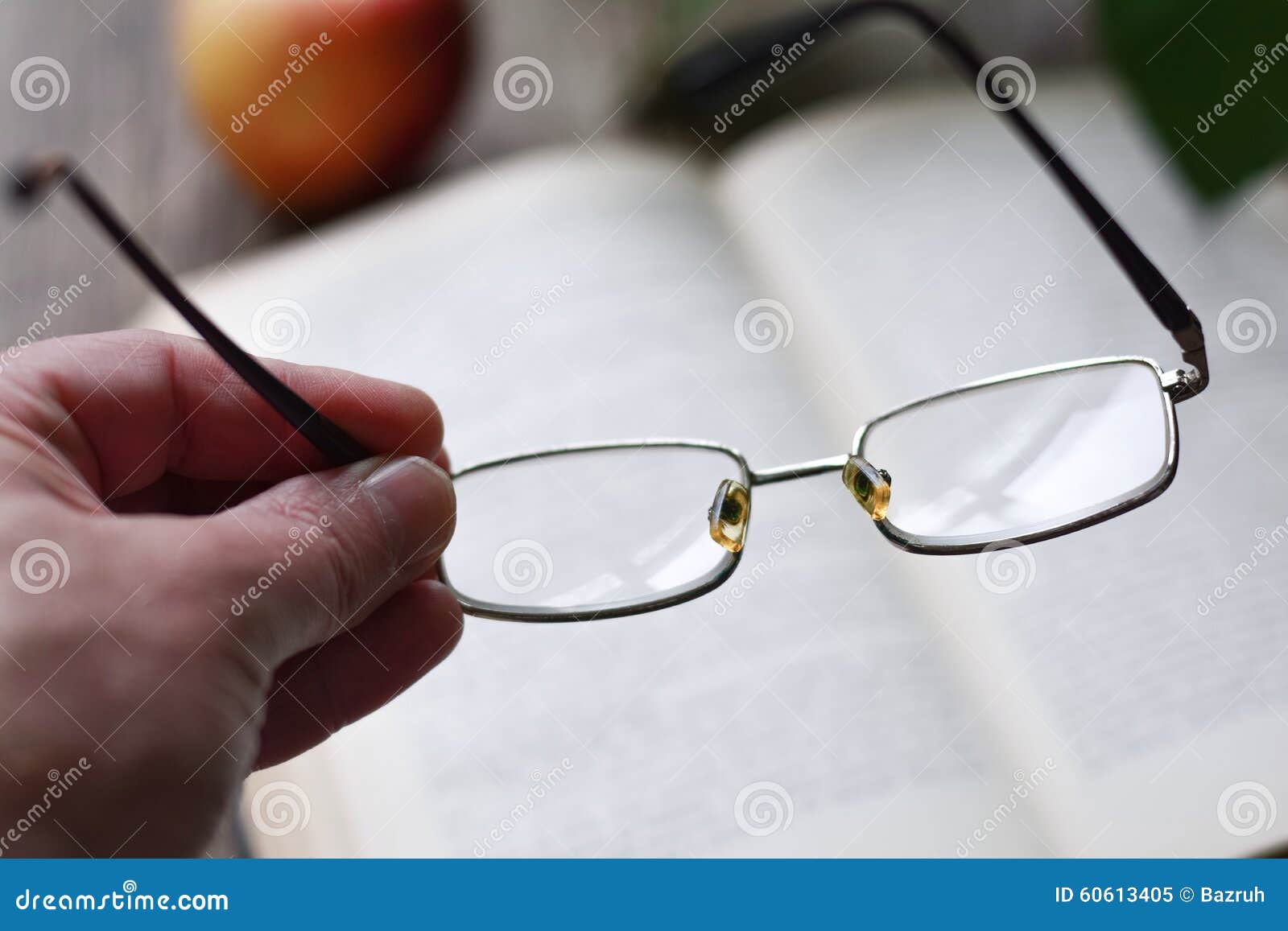 Glasses in hand stock image. Image of eyesight, classic 60613405