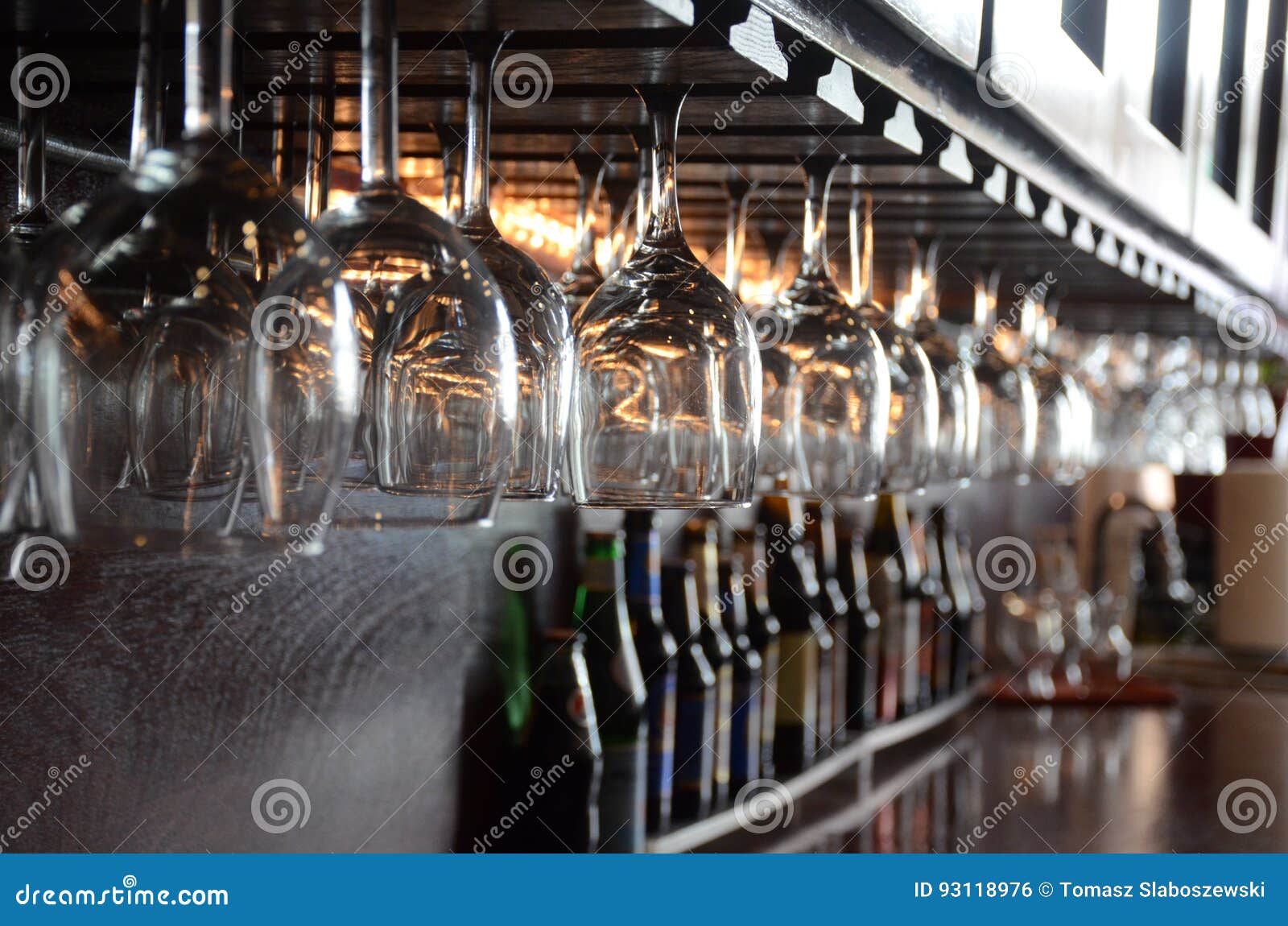 Glasses hanging at bar stock photo. Image of beverage 93118976
