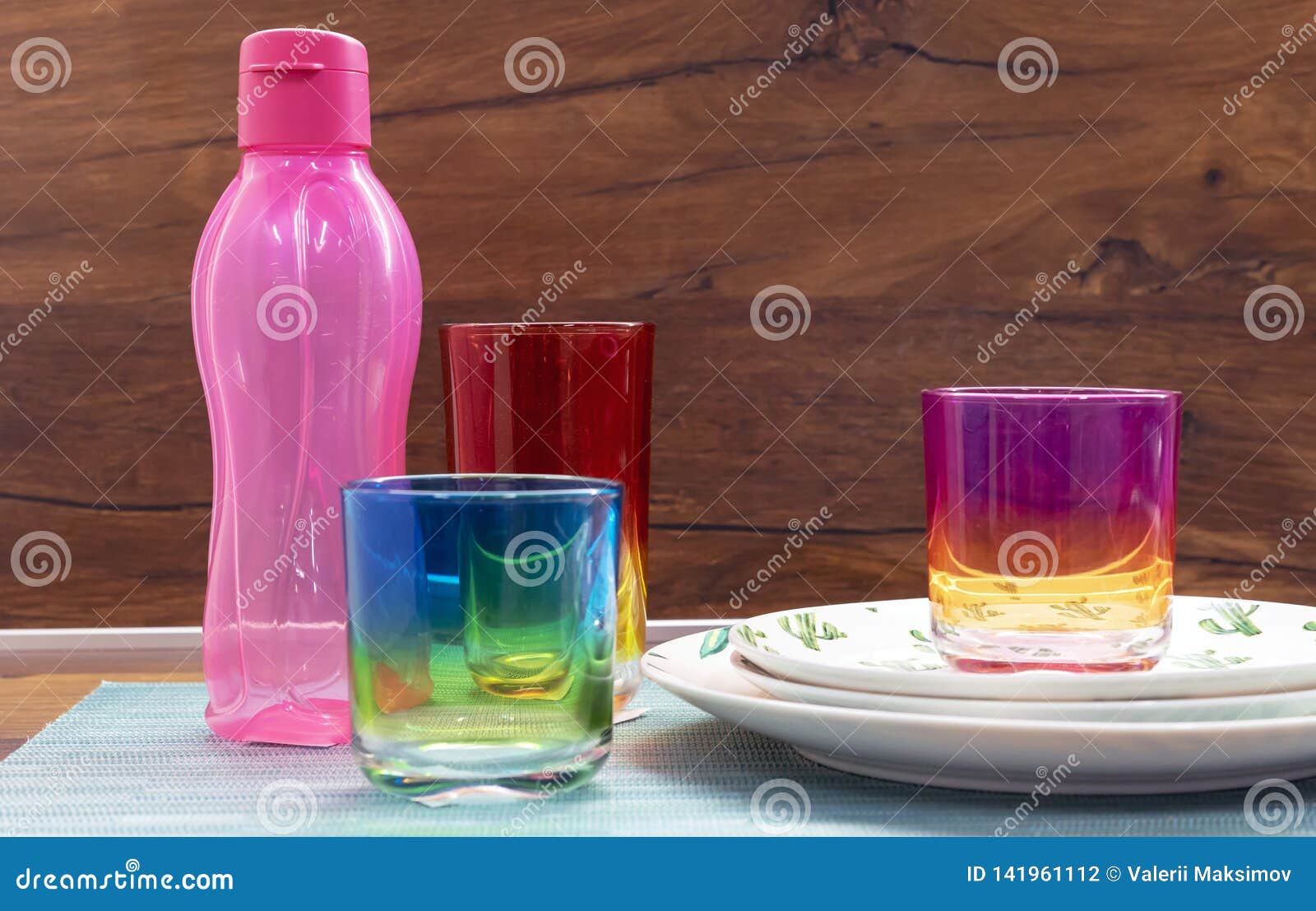 Glasses from Multicolored Glass and a Pink Bottle for Cold Drinks