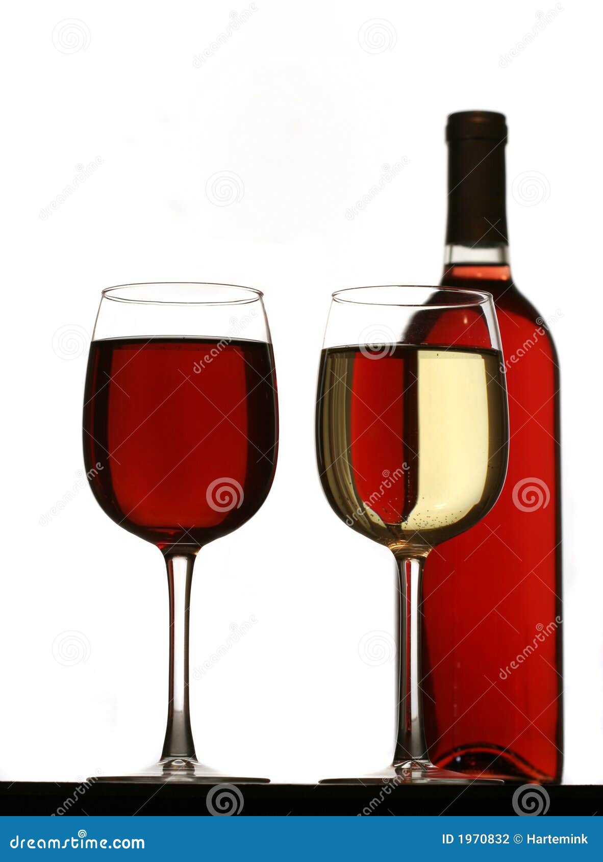 Glasses Of Red And White Wine, With Red Wine Bottle Stock Photo Image