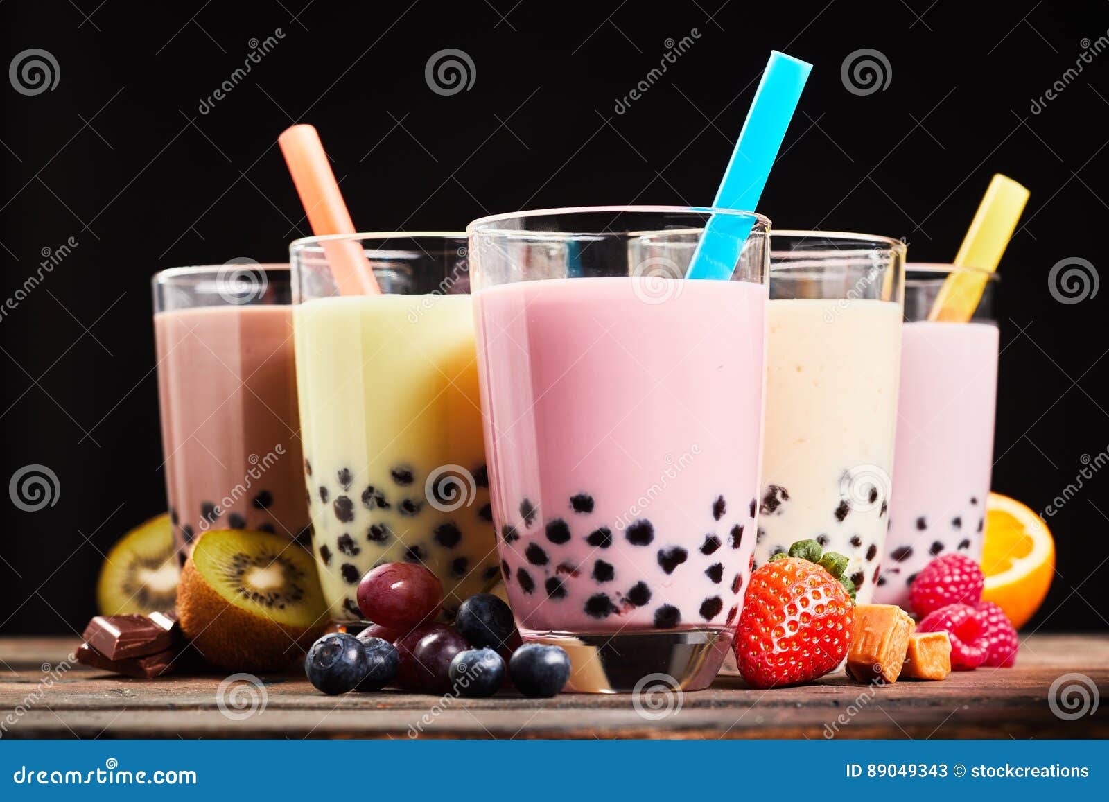 https://thumbs.dreamstime.com/z/glasses-refreshing-milky-boba-bubble-tea-assorted-fresh-fruit-ingredients-chocolate-caramel-candy-used-as-flavoring-89049343.jpg