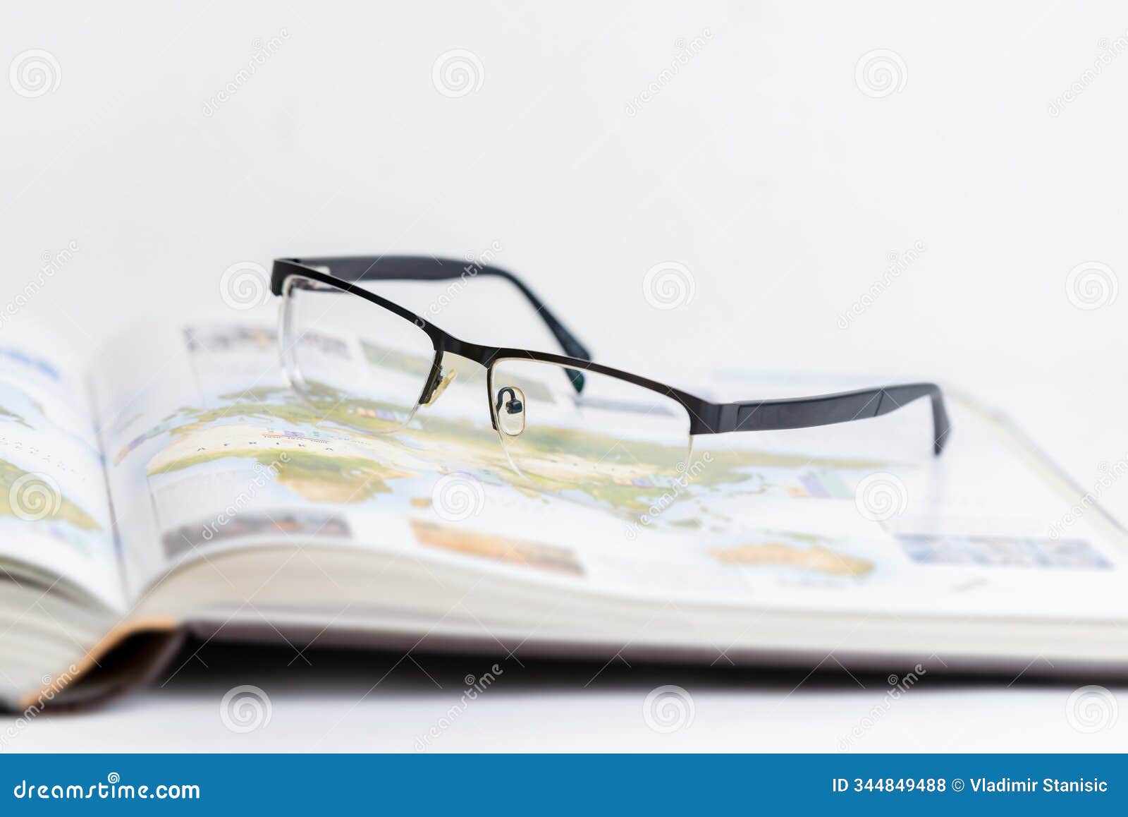 glasses resting on open book, izing relaxation after intense research
