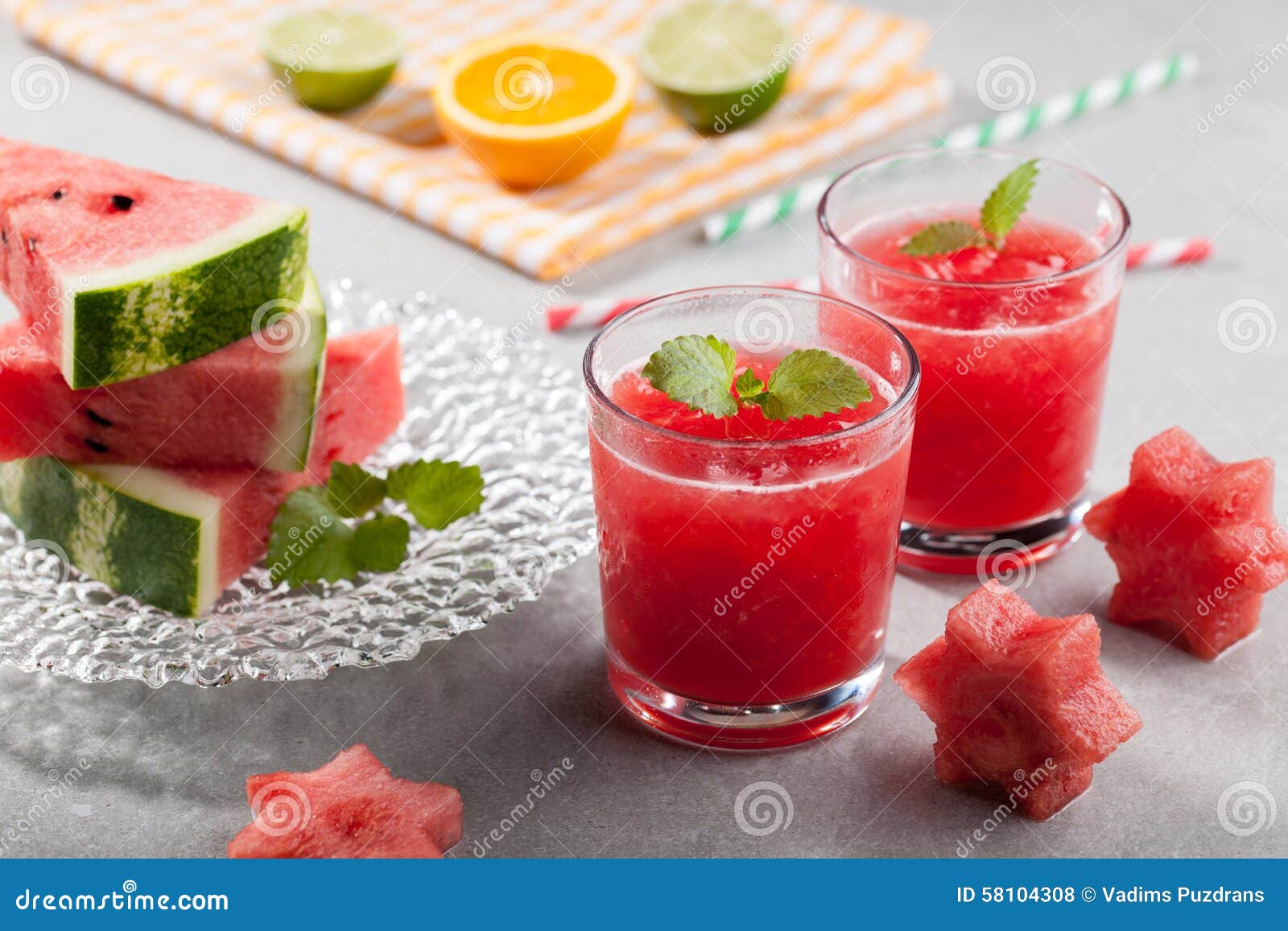 Glasses of Watermelon Juice with Ice and Watermelon Figurines Stock