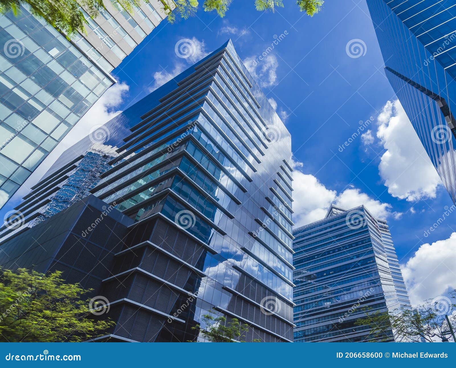 glassy highrises along 5th avenue, bonifacio global city in philippines. a modern central business district