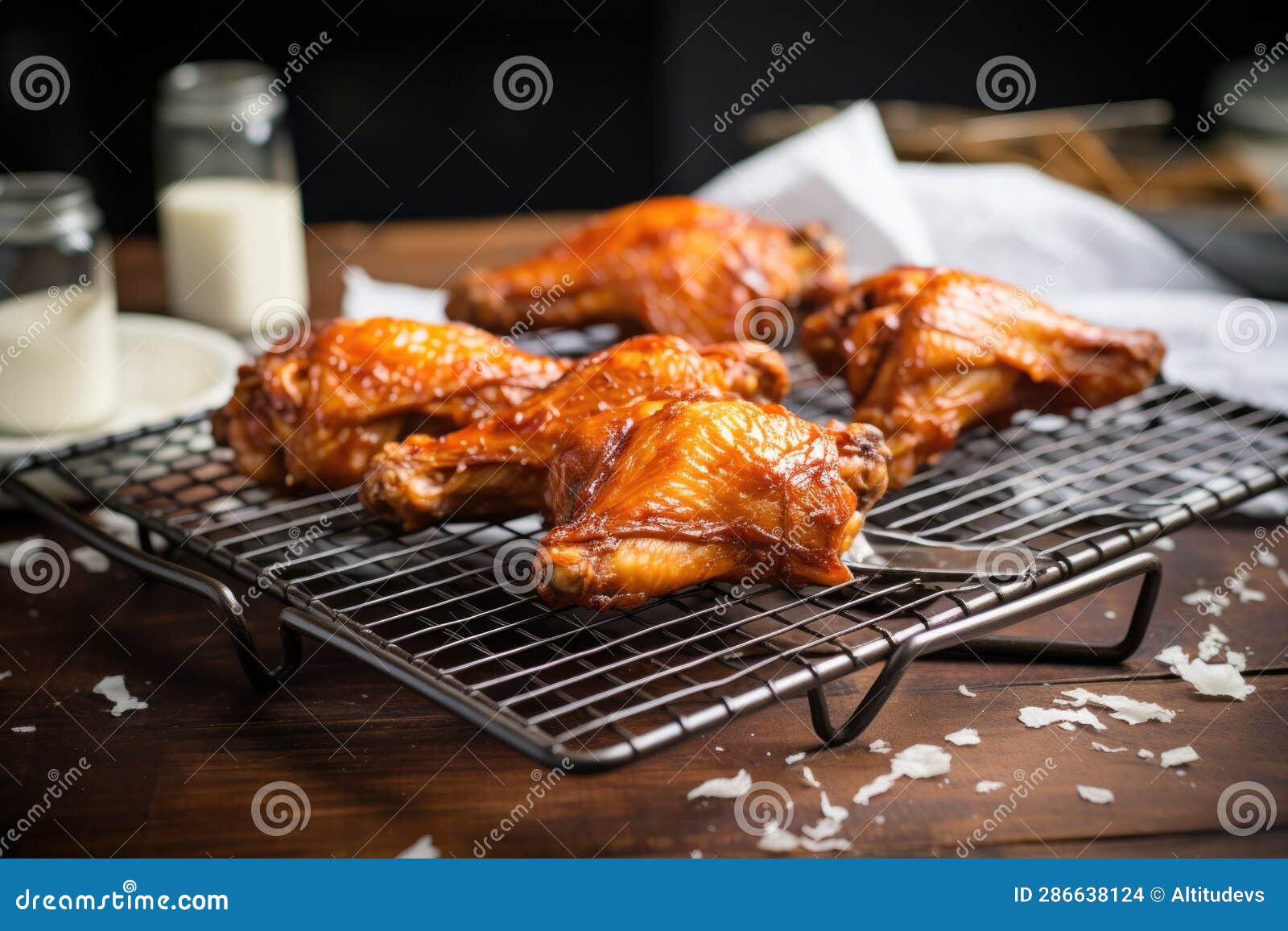 Glazed Buffalo Wings on Cooling Rack with Parchment Paper Stock