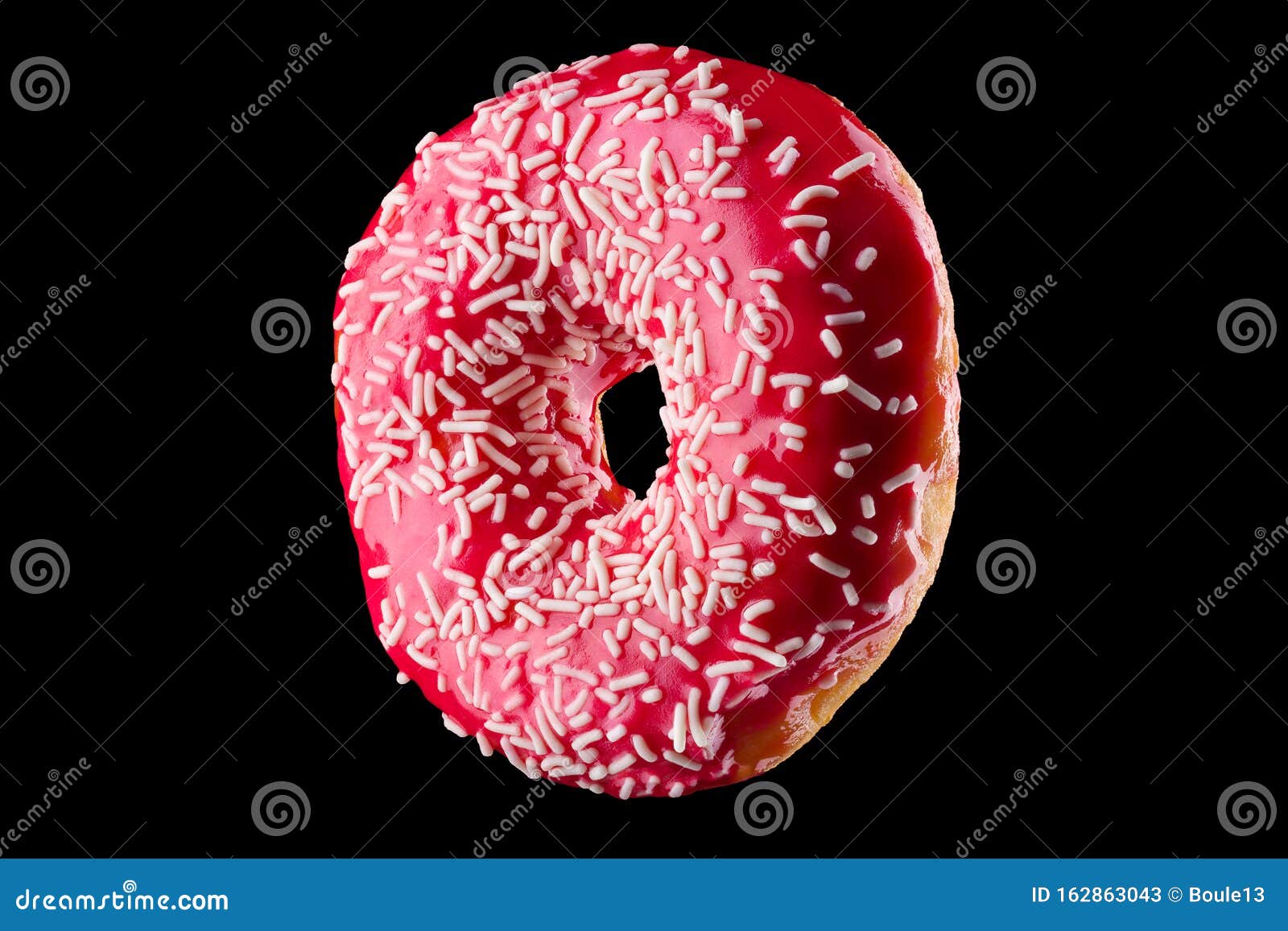 Glazed Donut With Sprinkles On A Black Background Rotated In Three