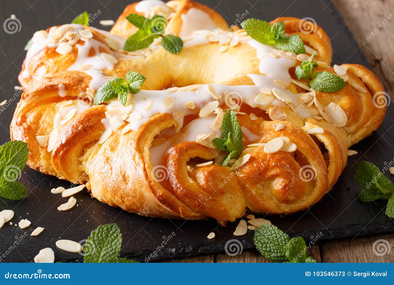 Glazed Round Brioche Cake with Cheese Cream and Almonds Closeup