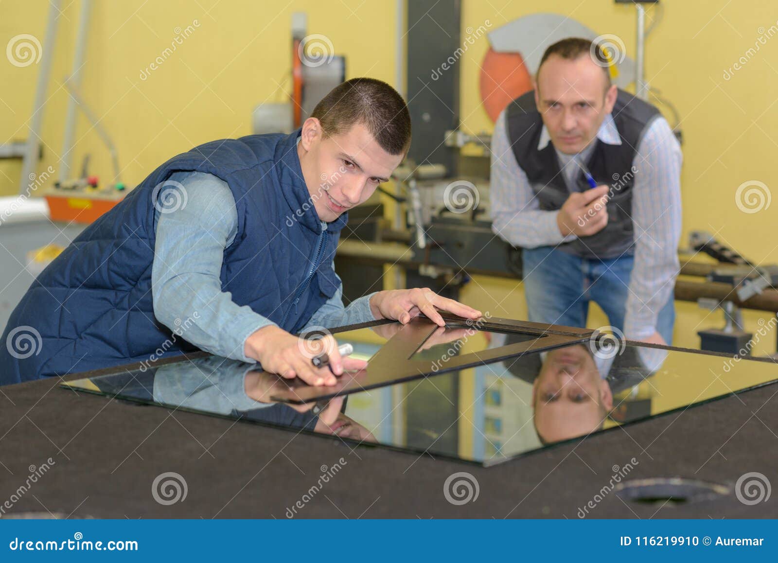 Glazier working on window stock photo. Image of glass 116219910