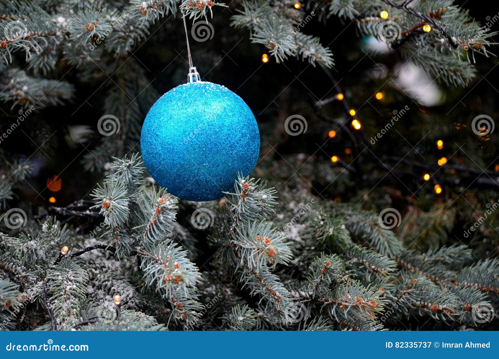 Glittering Blue Hanging Ball Decoration on Christmas Tree Stock Image ...
