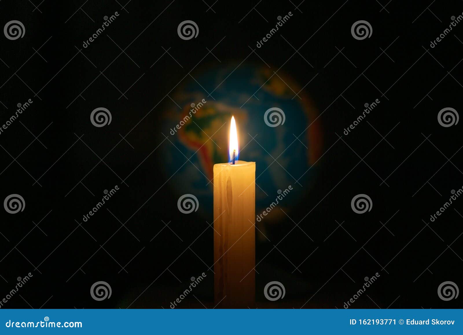 Globe Illuminated by Candle. Concept of Global Warming or Earth Hour. Soft Focus Stock Image
