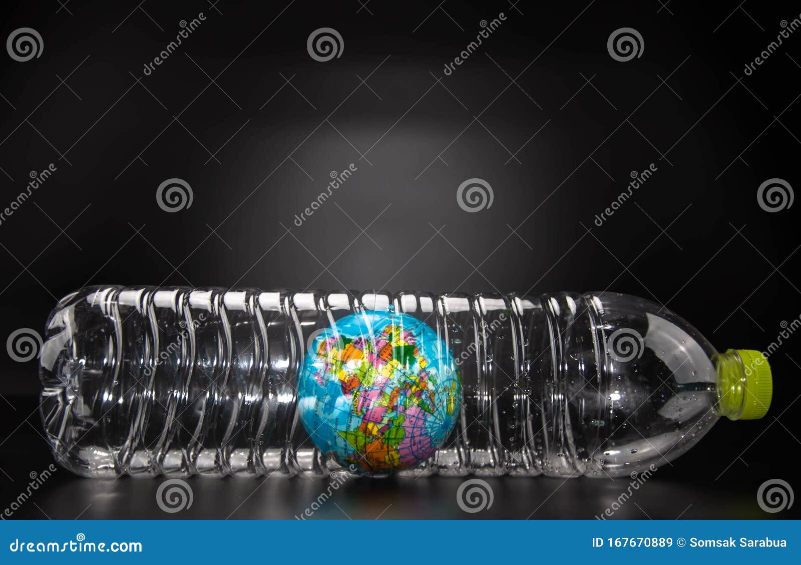 A Globe in a Plastic Bottle on Black Background, Which is Concept of