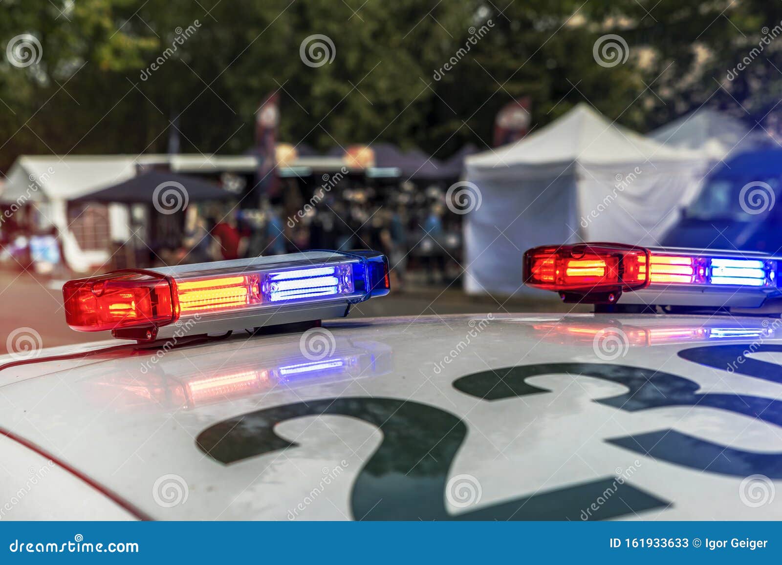 Glowing Red blue Flashing Lights on the Roof of a Police Car Stock