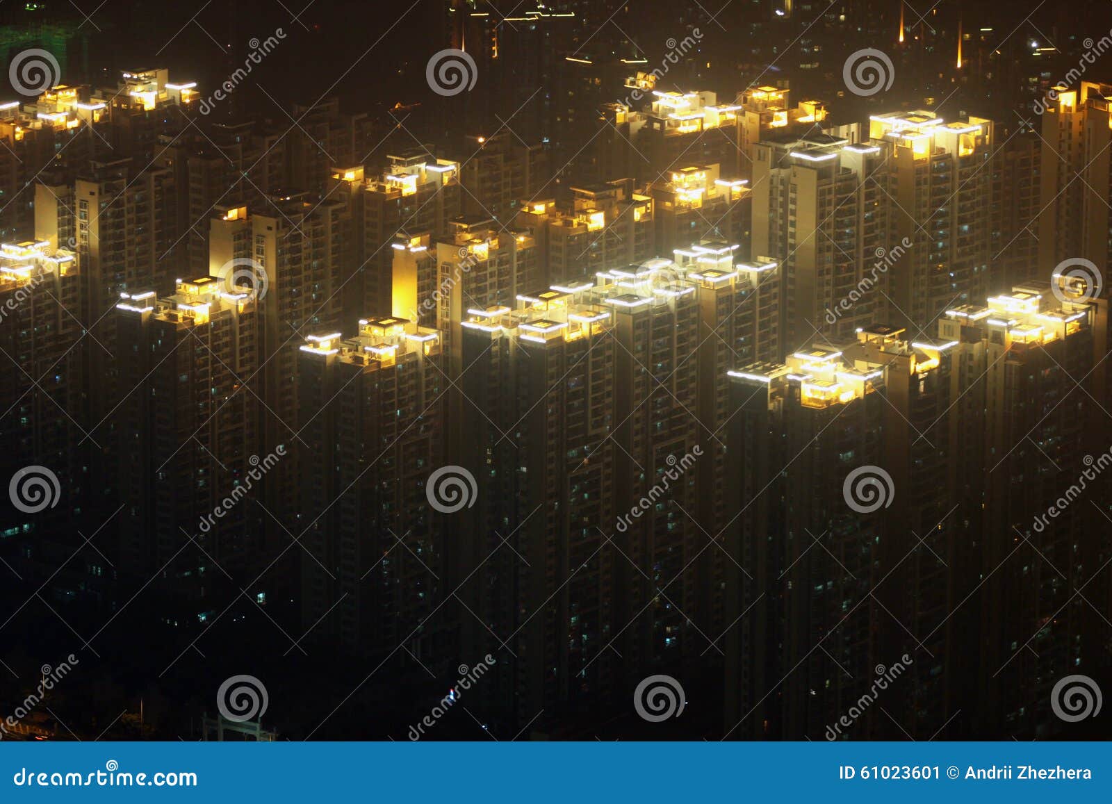 glowing roofs of residential highrises in foggy guangzhou, china