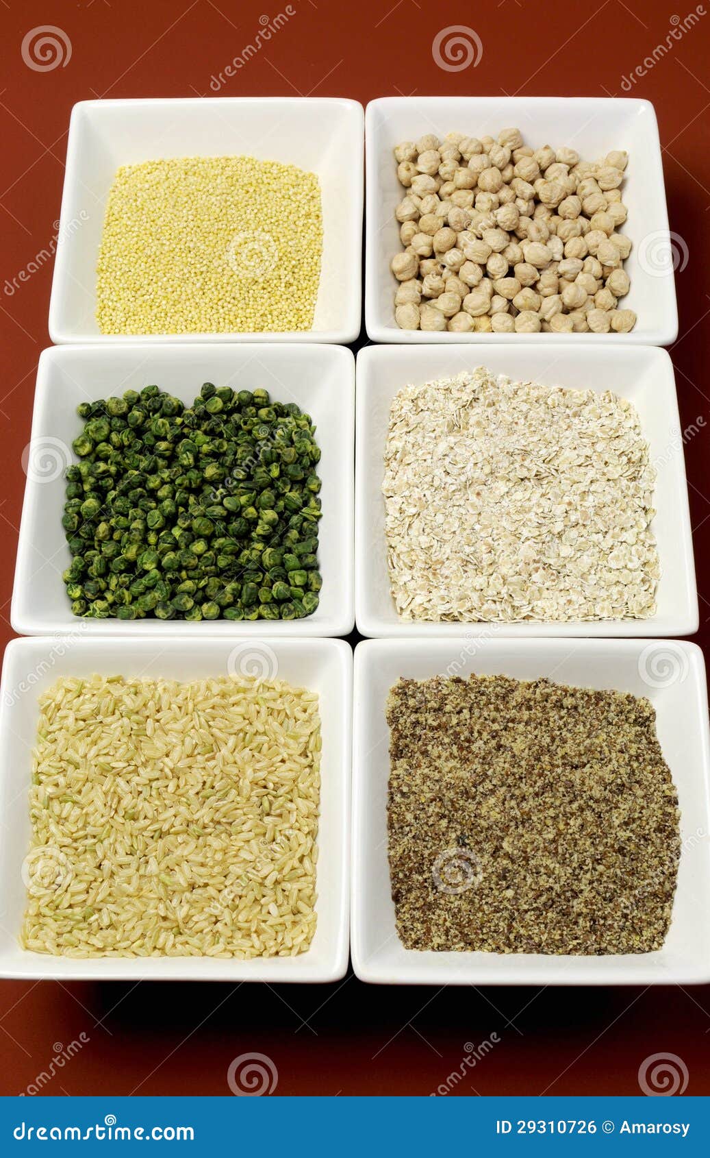 gluten free grains food - brown rice, millet, lsa, buckwheat flakes and chickpeas and green peas legumes - vertical