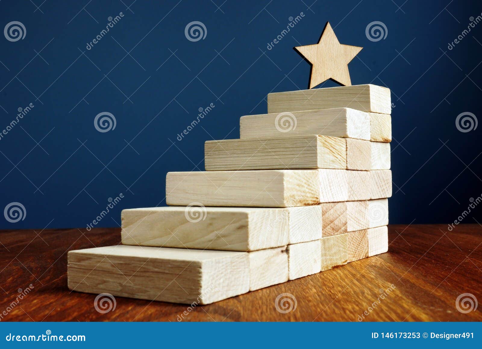 goal setting and achievement. star and stairs from wood