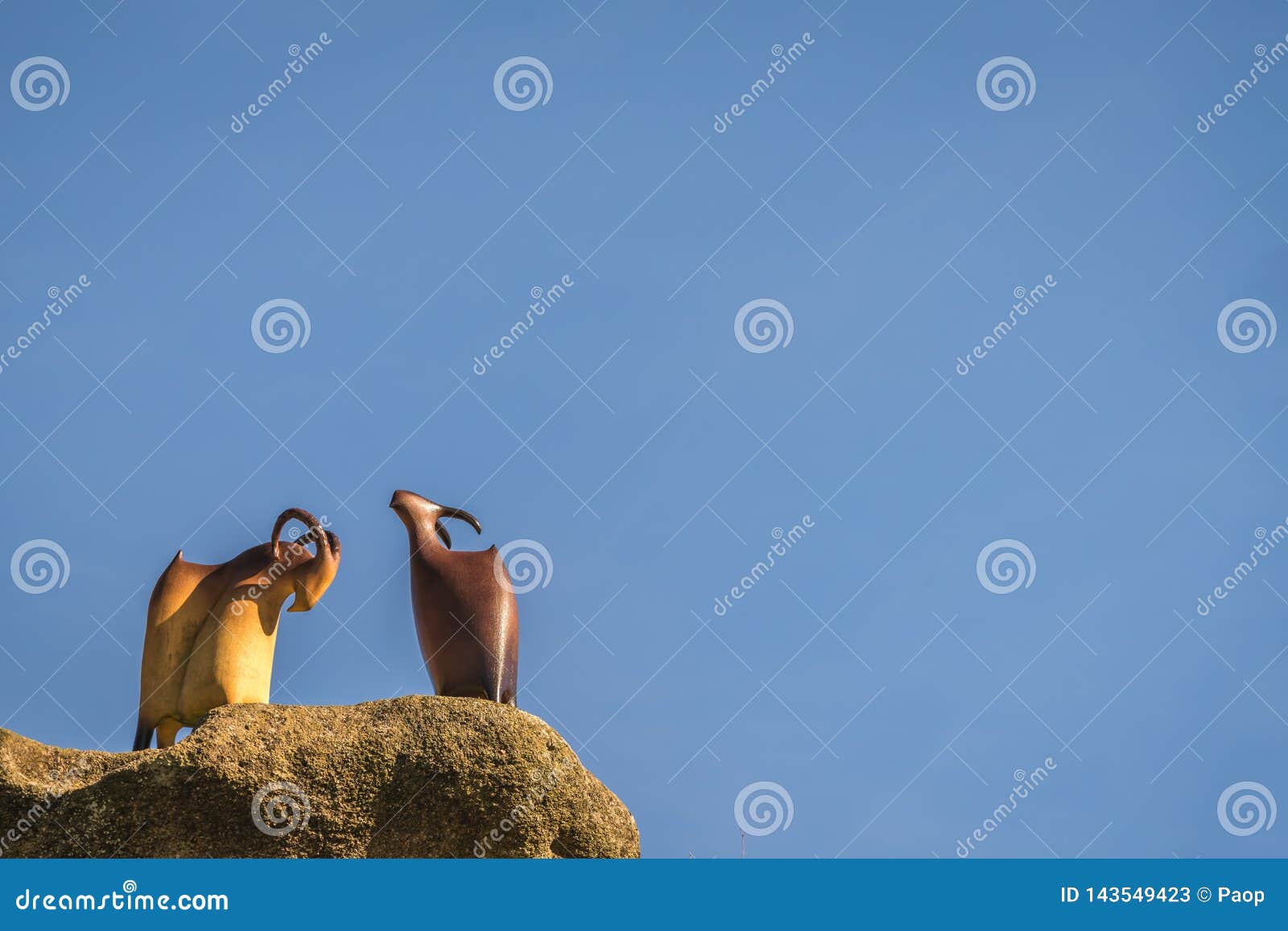 goat sculptures on a rock