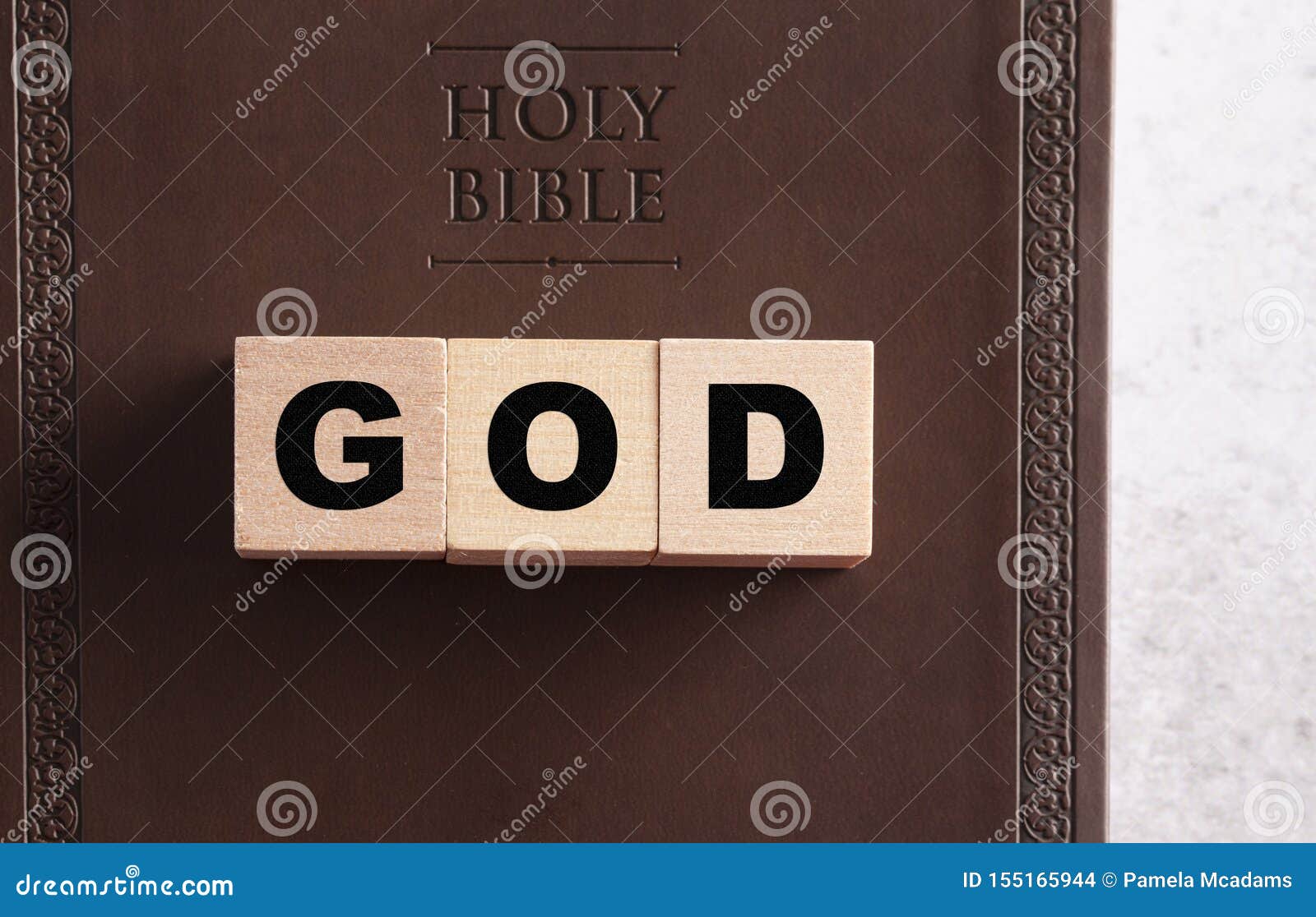 God Spelled in Blocks on a Leather Holy Bible Stock Photo Image of closed, message 155165944