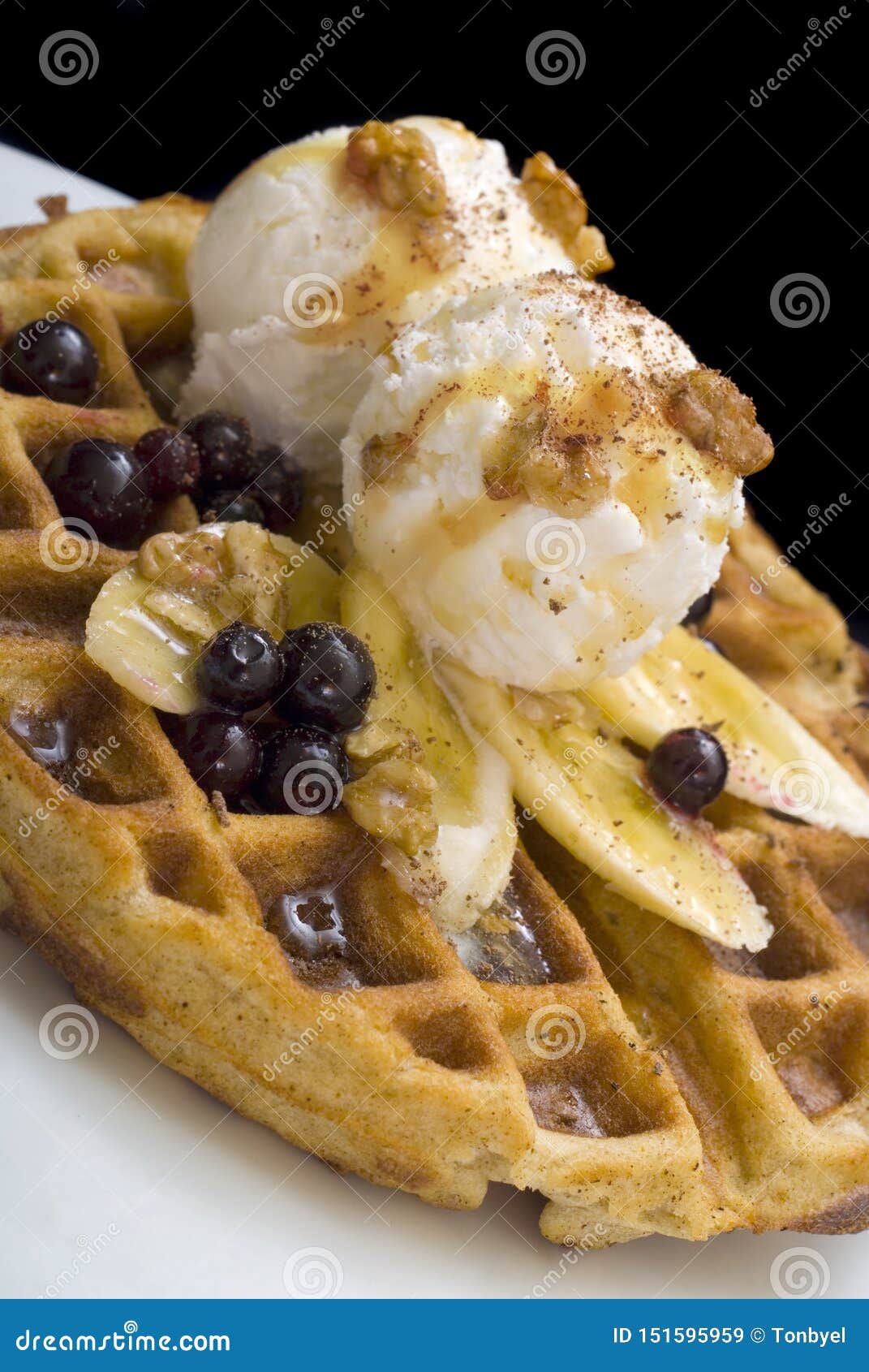 gofre - belgian homemade waffles with ice cream, bananas and nuts