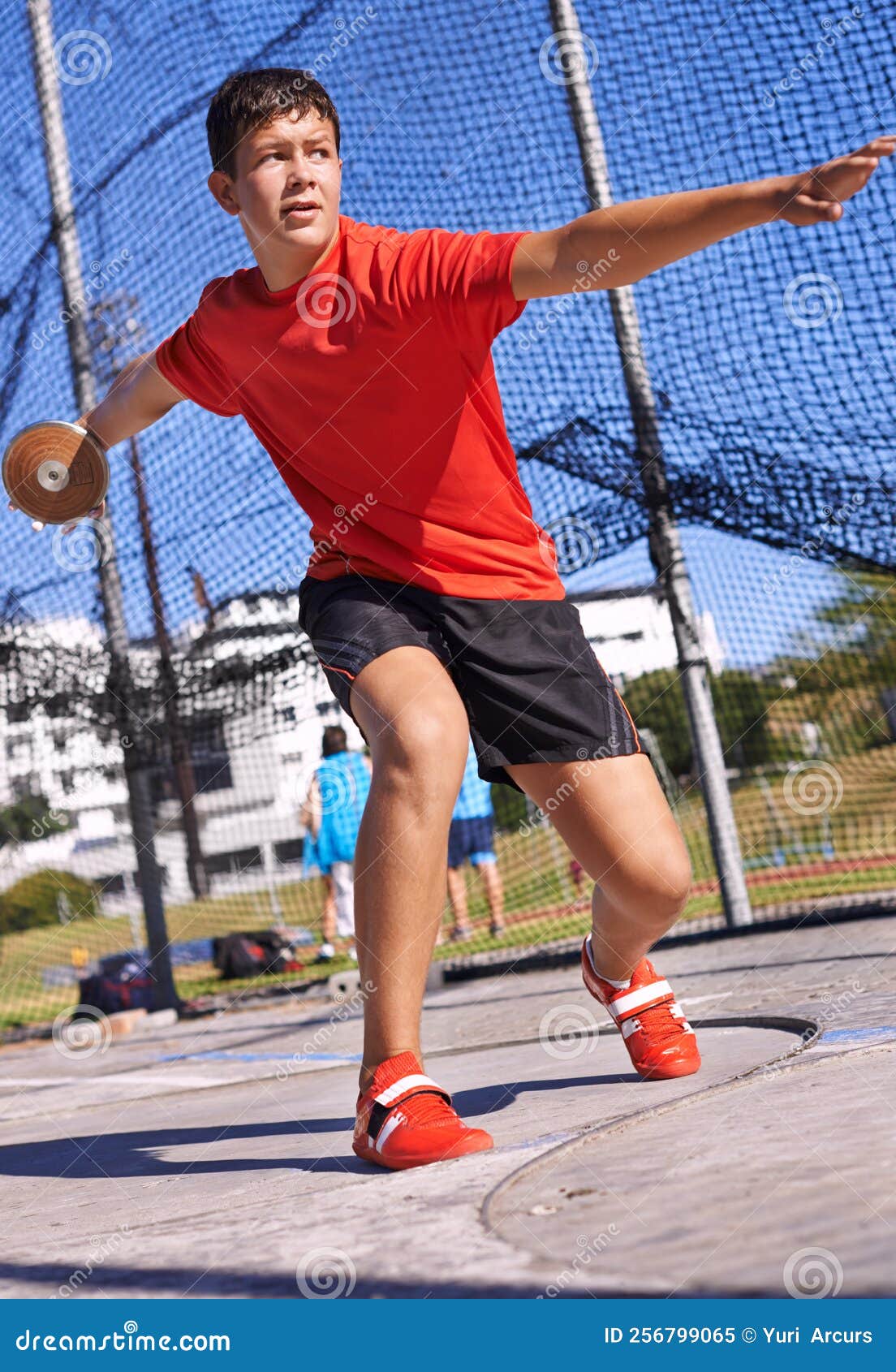 Going the Distance. a Young Sportsman Throwing a Discus. Stock Image