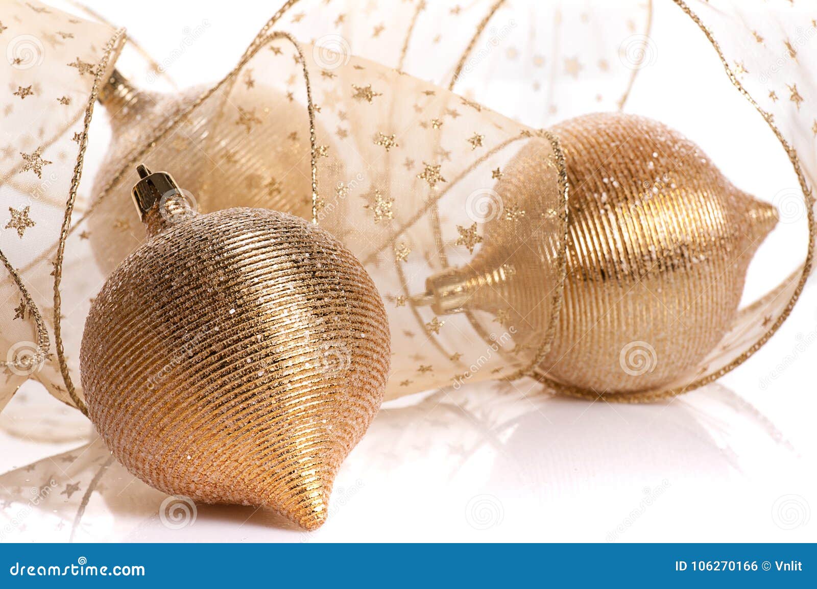 Gold balls with transparent golden ribbon on white background