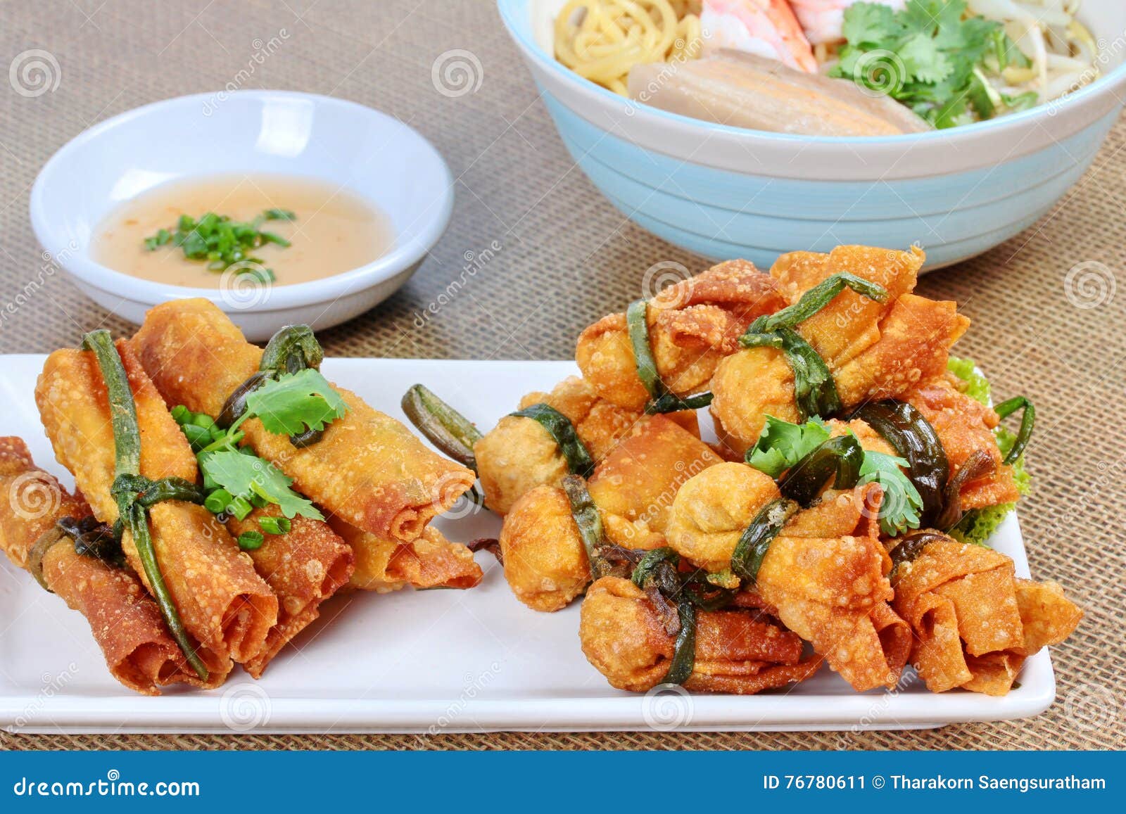 Gold bar and gold bag food with side dish. Selective focus. Deep fried Chinese sheet wrap minced pork by shallot,served with sweet sauce as &quot;gold bar and gold bag&quot; are Chinese food for felicitous celebration