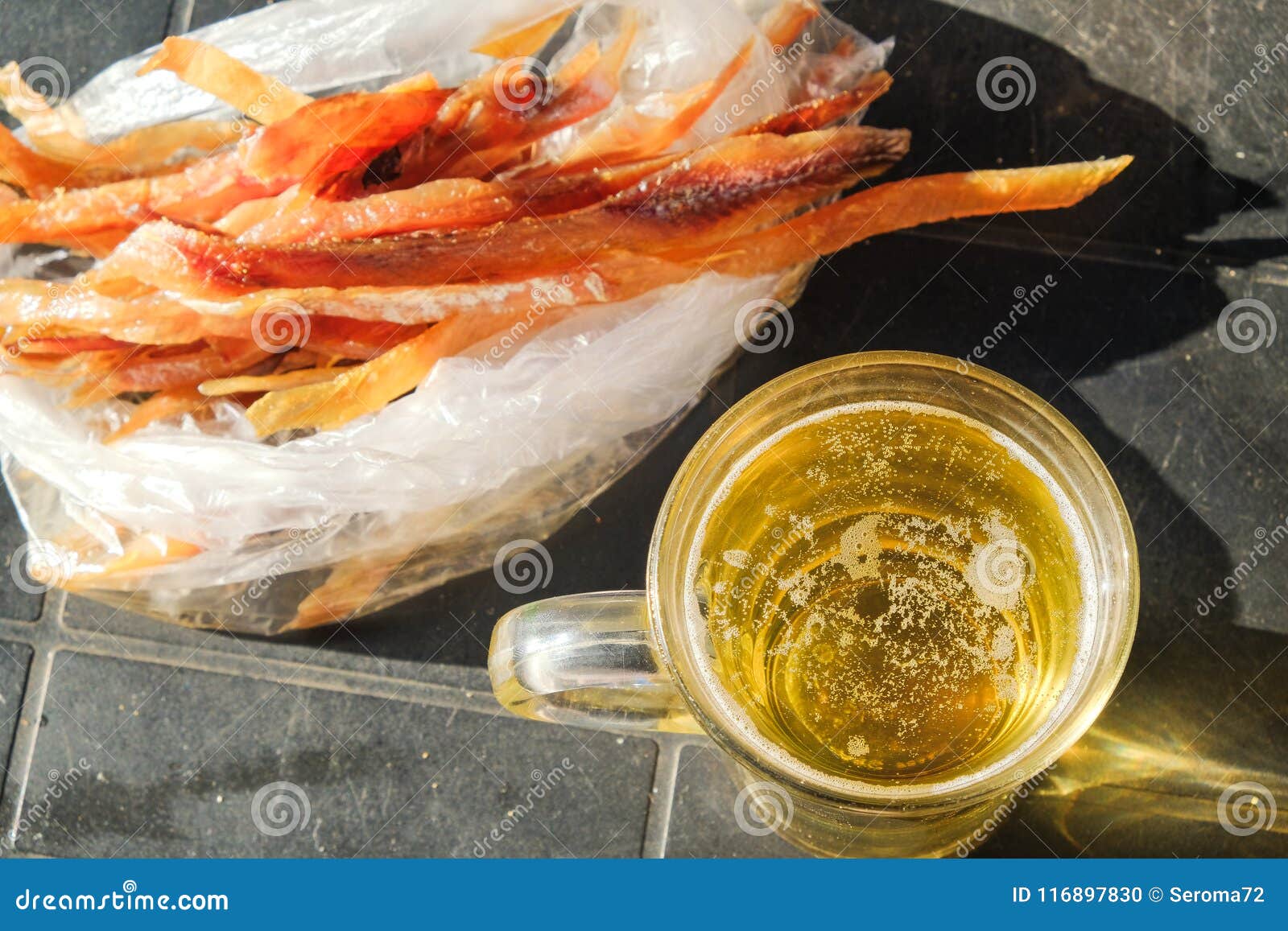 Gold beer with fish stock photo. Image of sabrefish 116897830